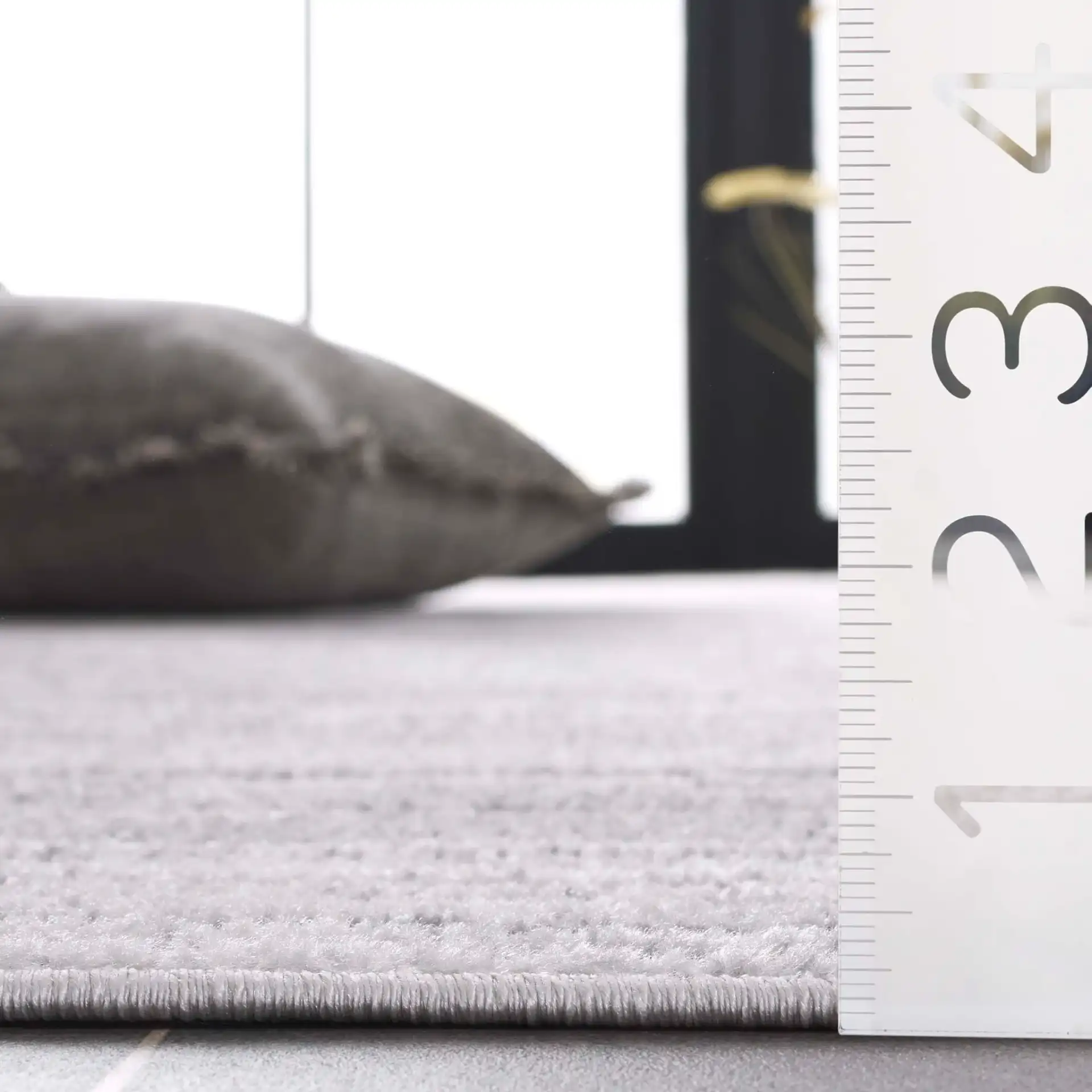 Stella Striated Stripe Outdoor Rug in Ivory / Gray in a styled room