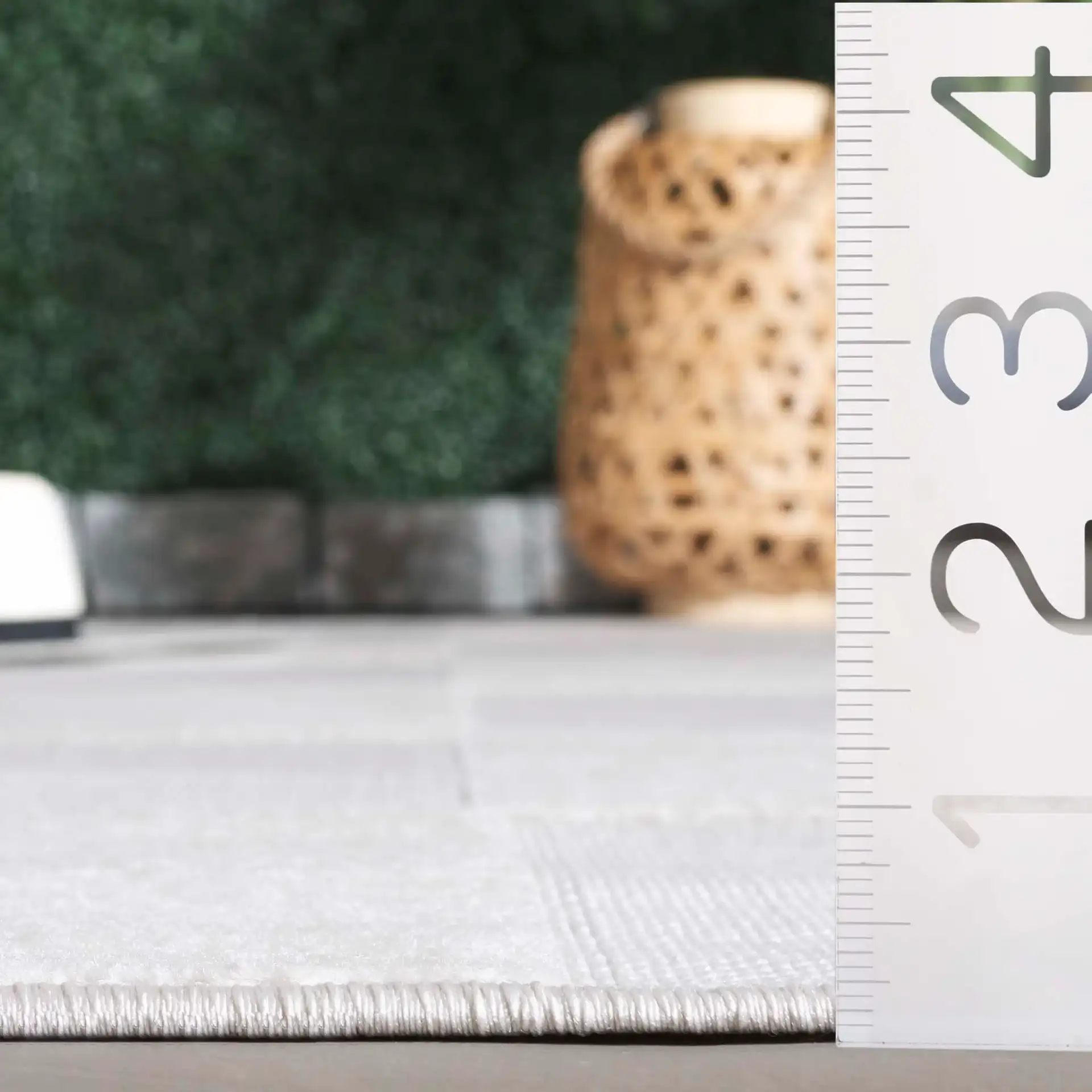 Stella Geometric Block Outdoor Rug in Ivory in a styled room
