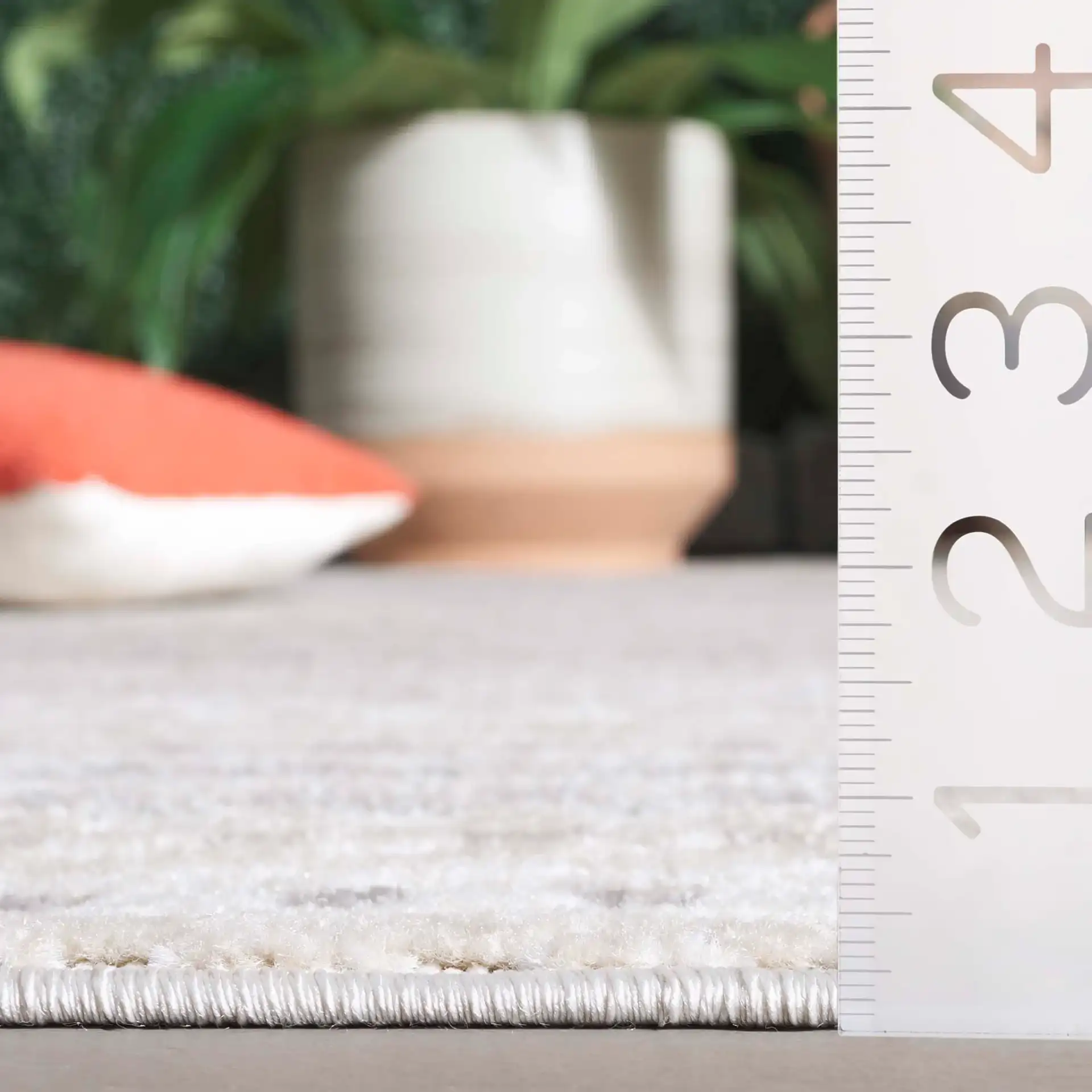 Stella Dotted Stripe Outdoor Rug in Beige / Gray in a styled room