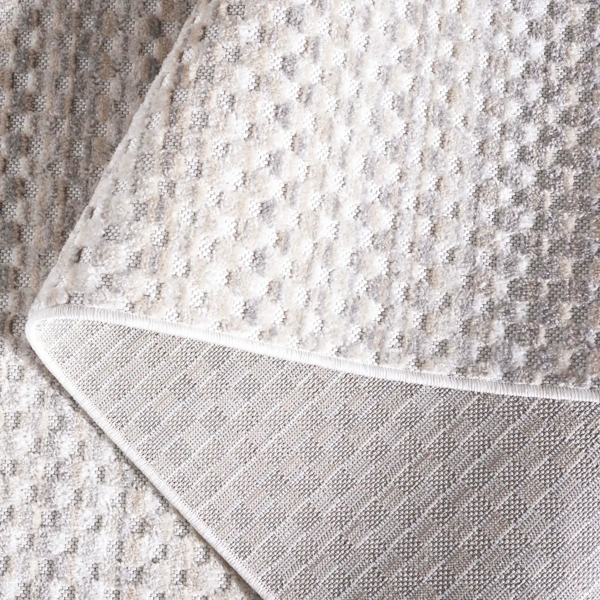 Stella Dotted Stripe Outdoor Rug in Beige / Gray in a styled room