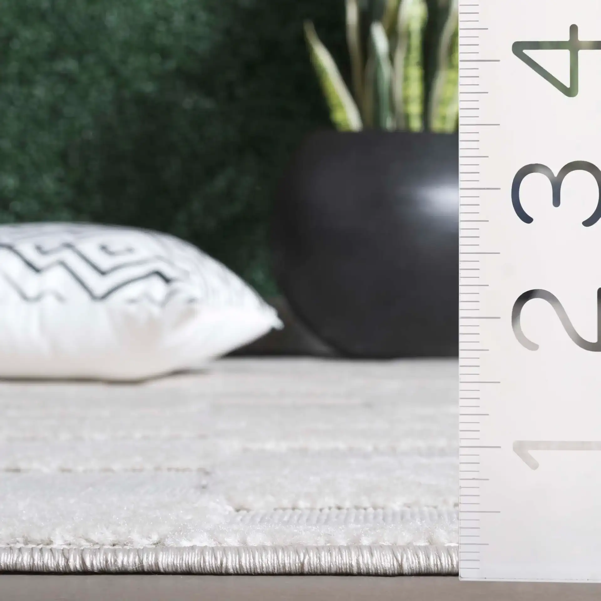 Stella Wavy Grid Outdoor Rug in Ivory in a styled room
