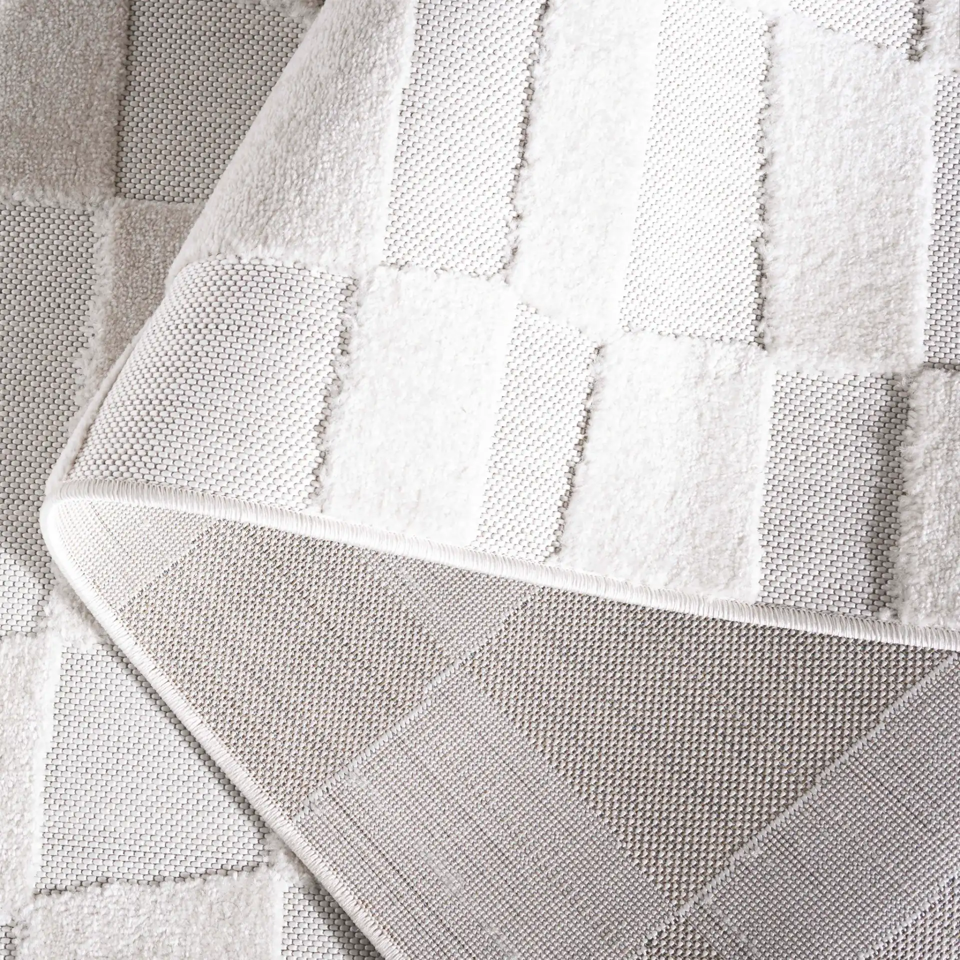 Stella Wavy Grid Outdoor Rug in Ivory in a styled room