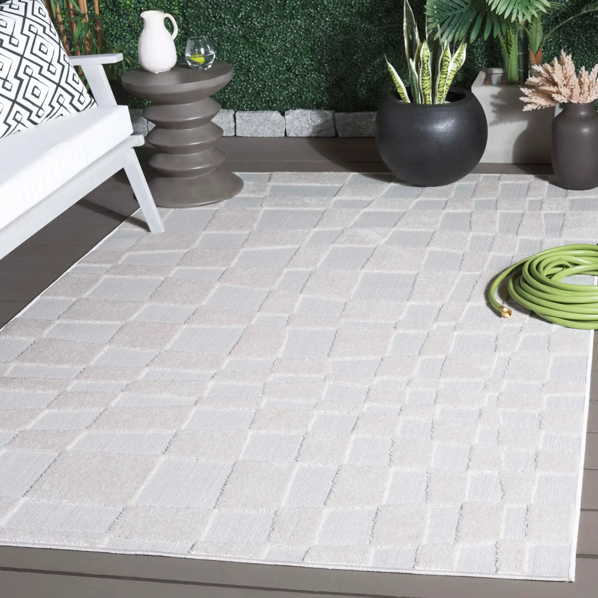 Stella Wavy Grid Outdoor Rug in Ivory in a styled room