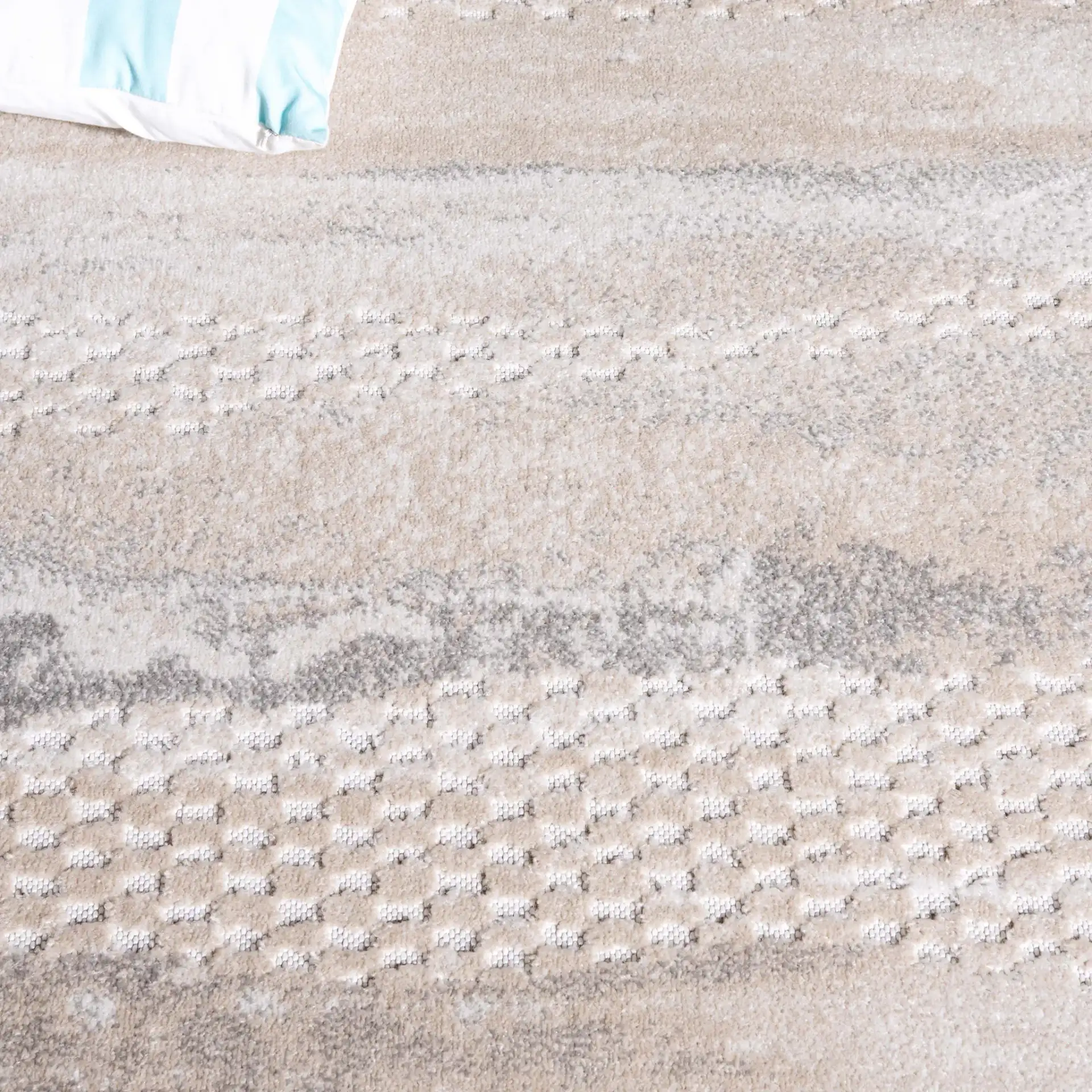Stella Banded Abstract Outdoor Rug in Beige / Gray in a styled room