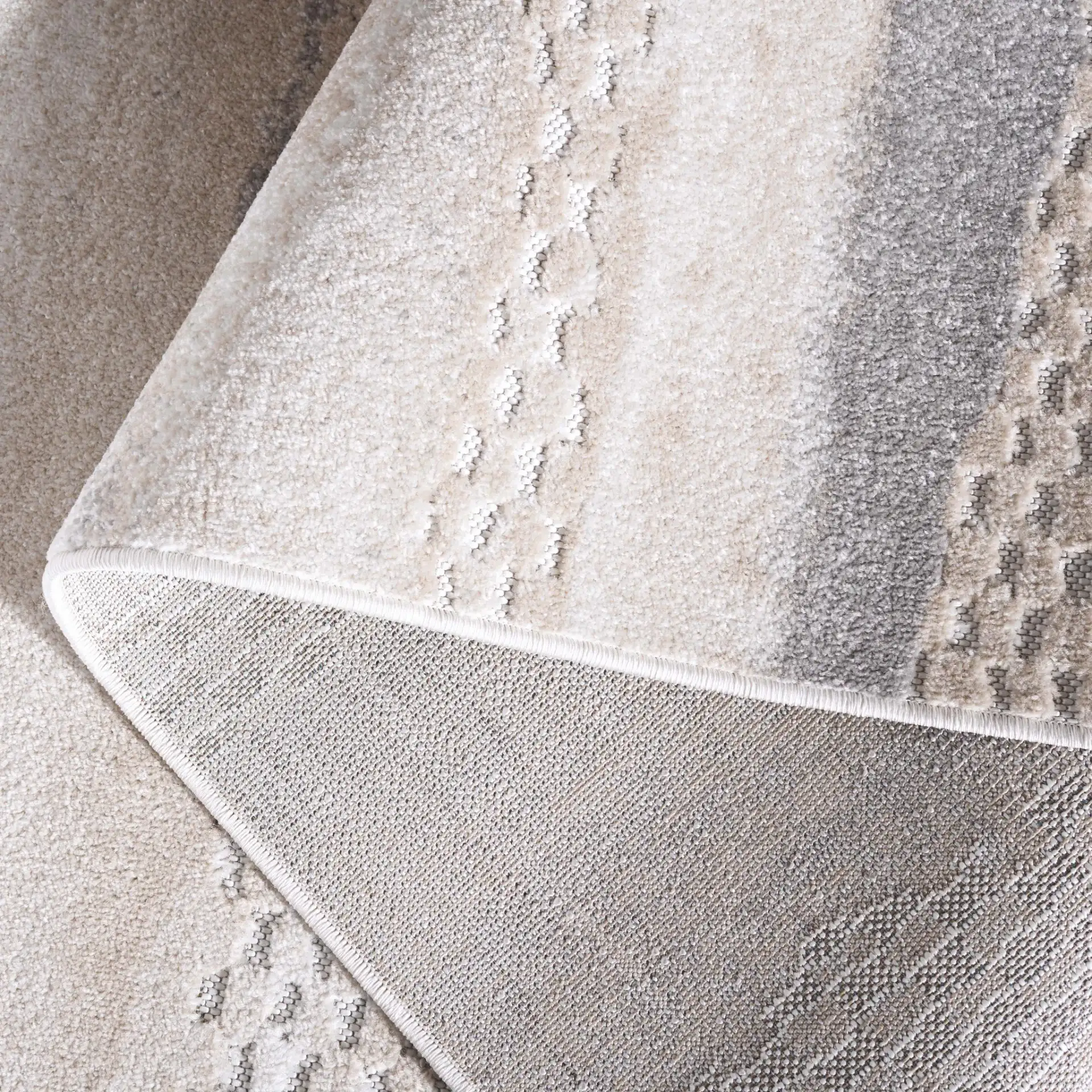 Stella Banded Abstract Outdoor Rug in Beige / Gray in a styled room
