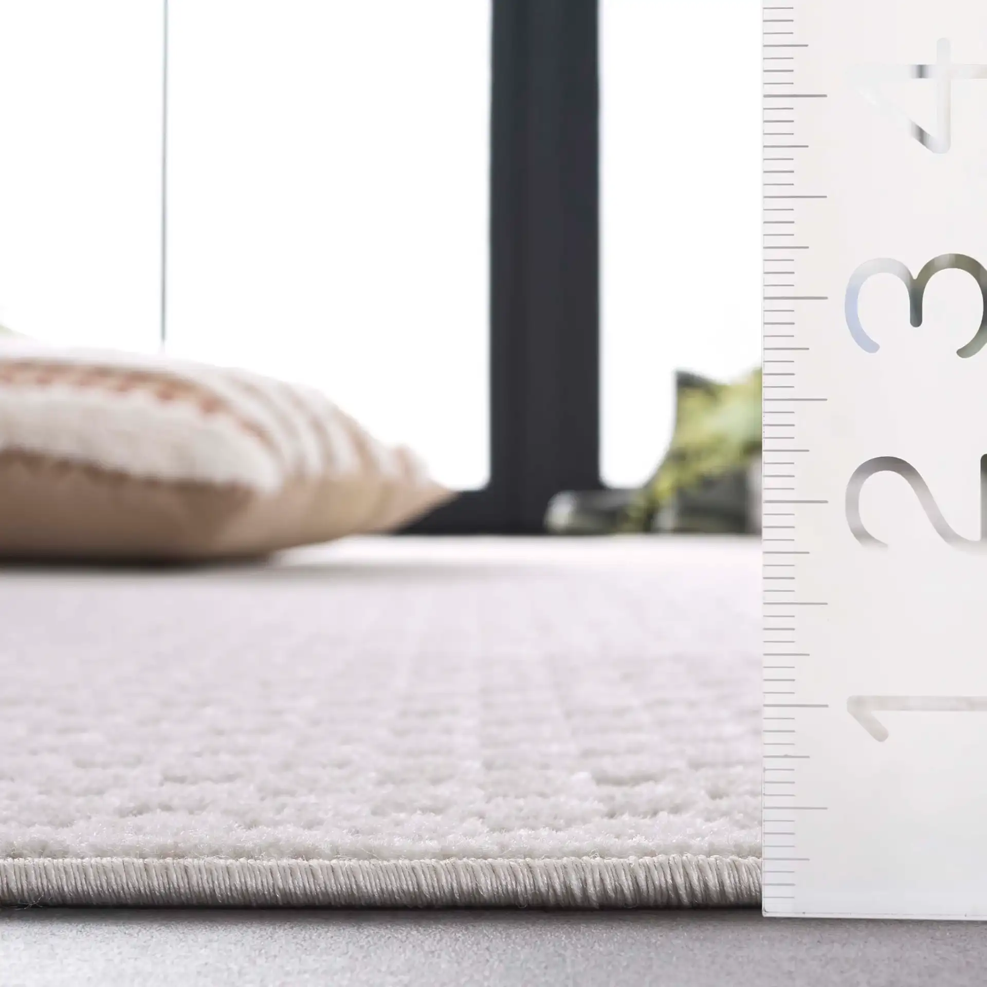 Stella Textured Grid Outdoor Rug in Ivory in a styled room
