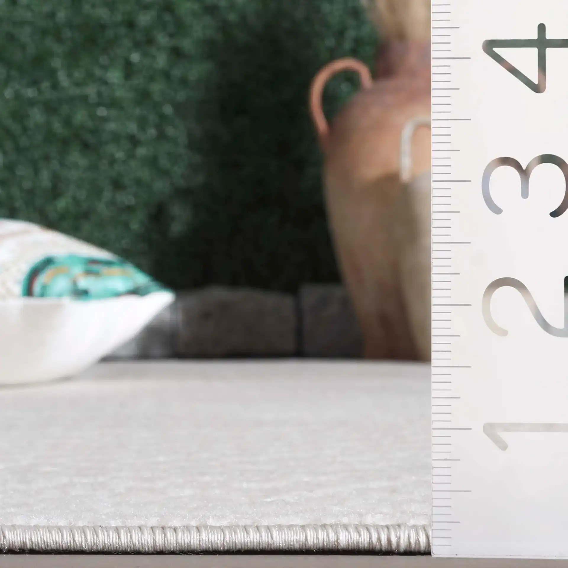 Stella Textured Grid Outdoor Rug in Ivory in a styled room