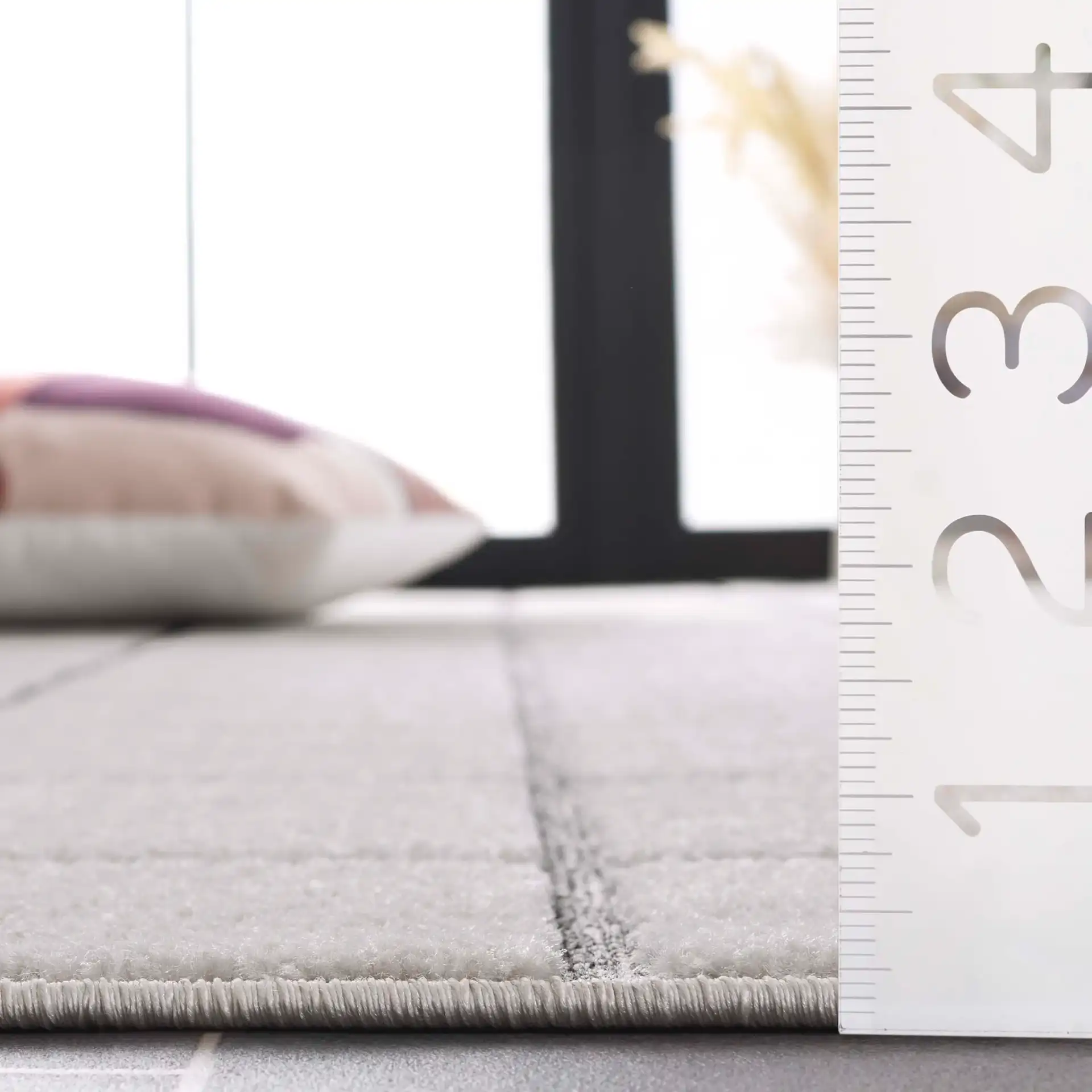 Stella Windowpane Grid Outdoor Rug in Ivory / Gray in a styled room