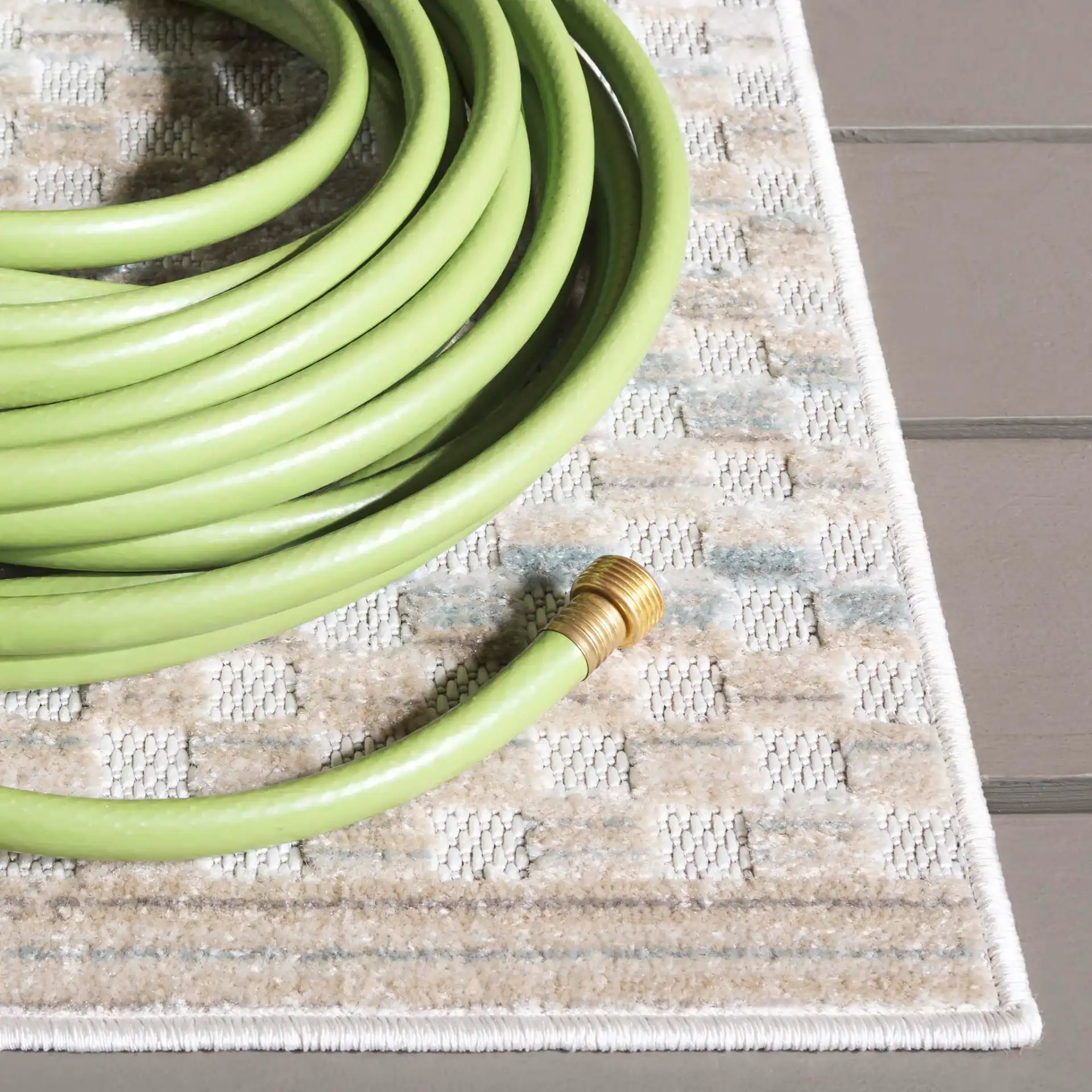 Stella Grid Stripe Outdoor Rug in Beige / Blue in a styled room