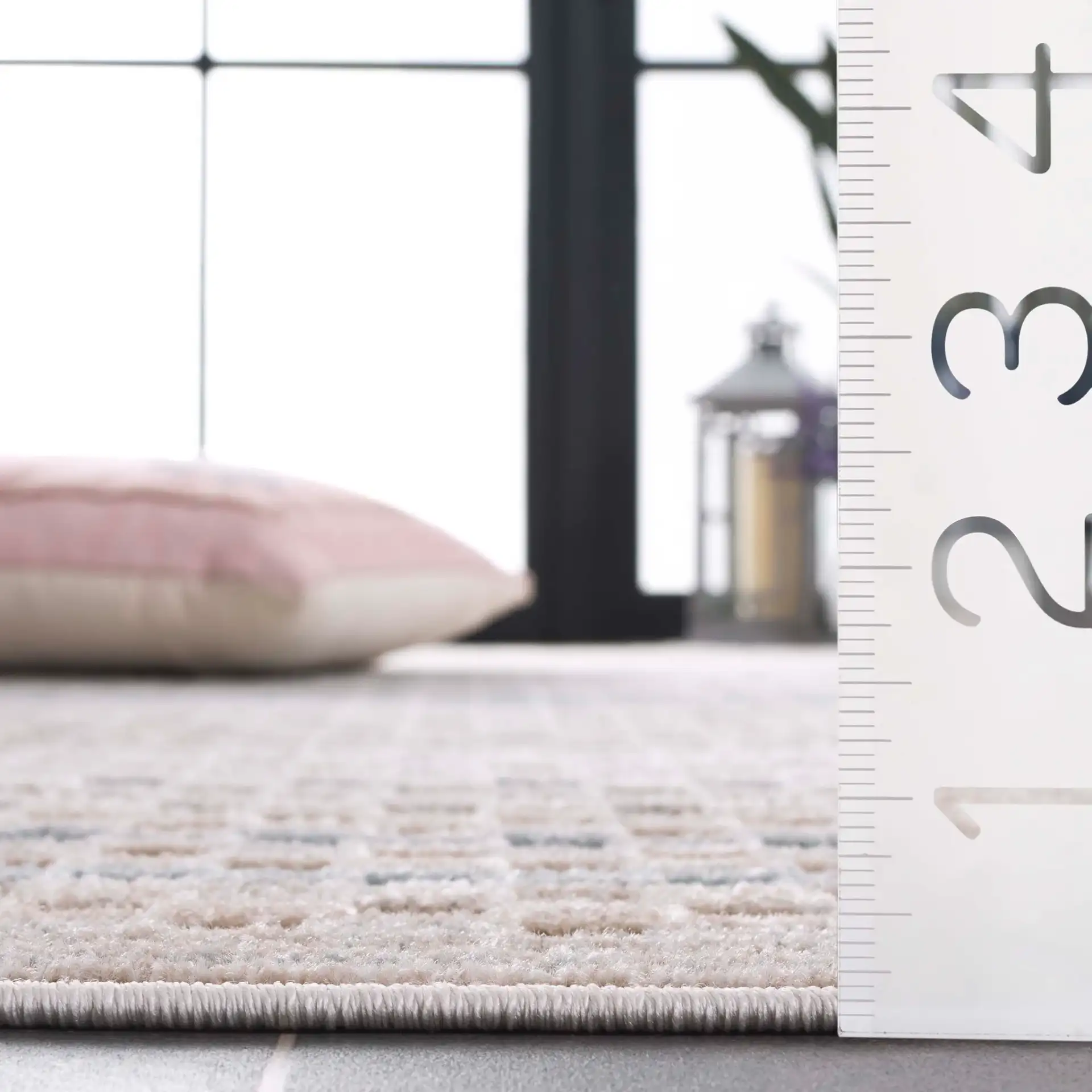Stella Grid Stripe Outdoor Rug in Beige / Blue in a styled room