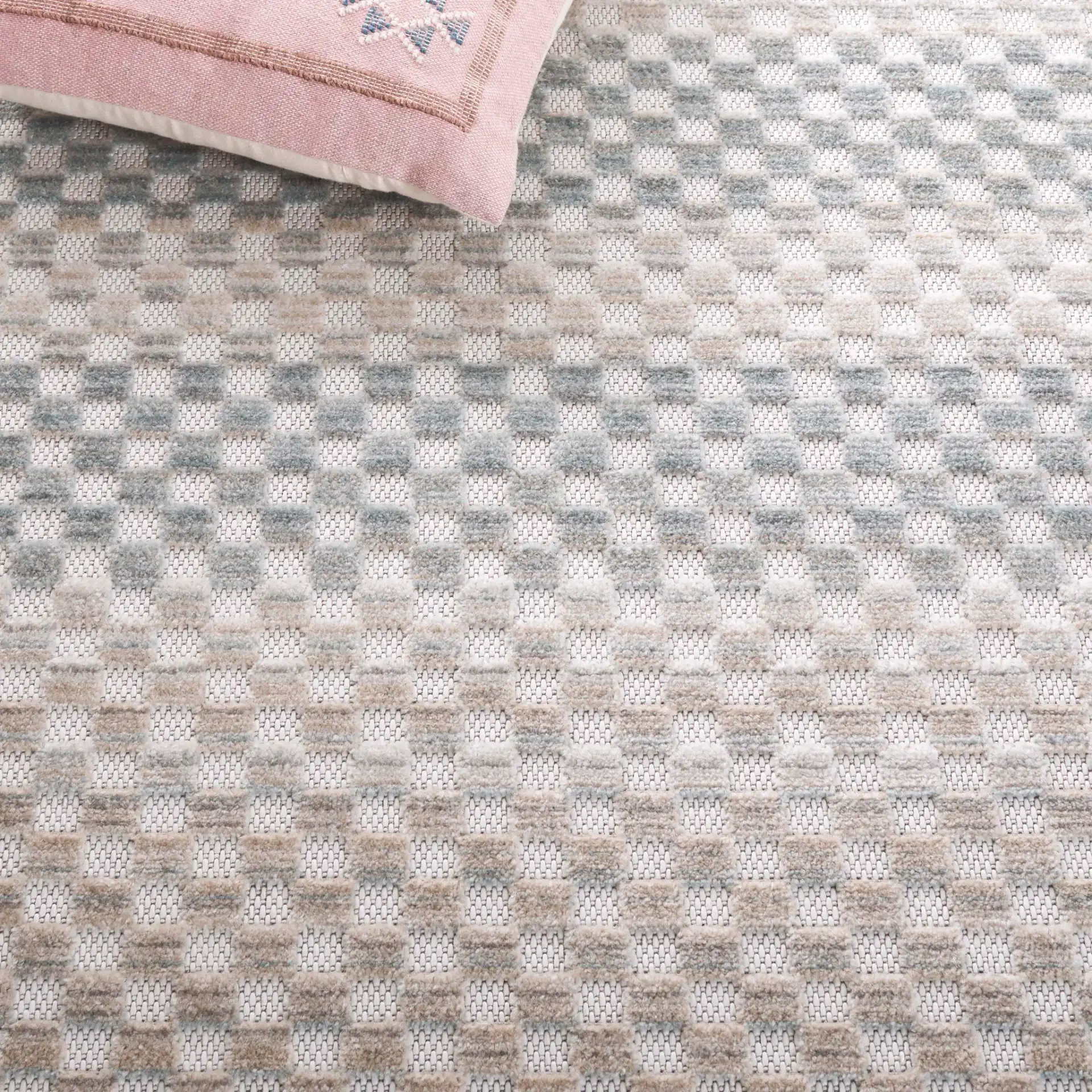 Stella Grid Stripe Outdoor Rug in Beige / Blue in a styled room