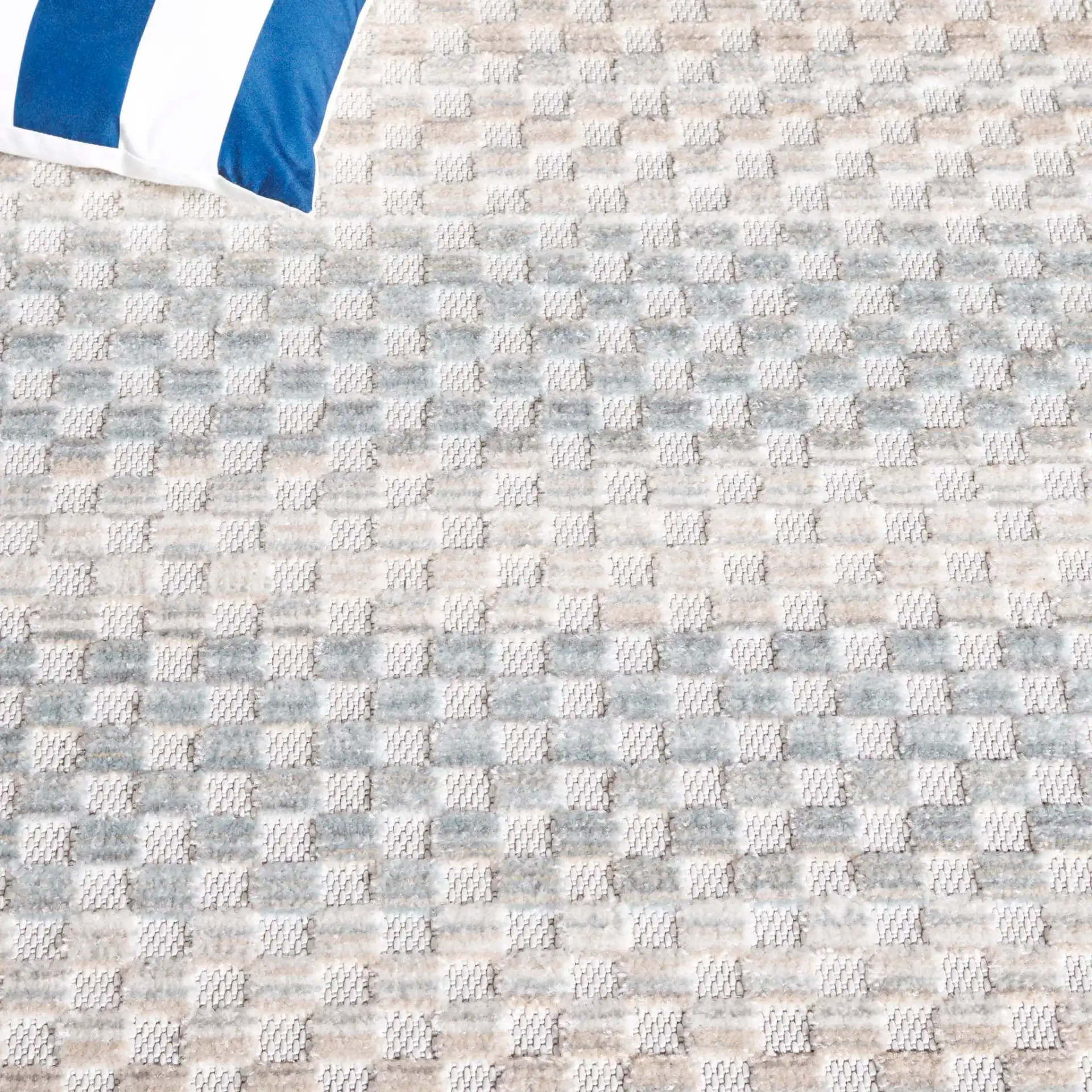 Stella Grid Stripe Outdoor Rug in Beige / Blue in a styled room