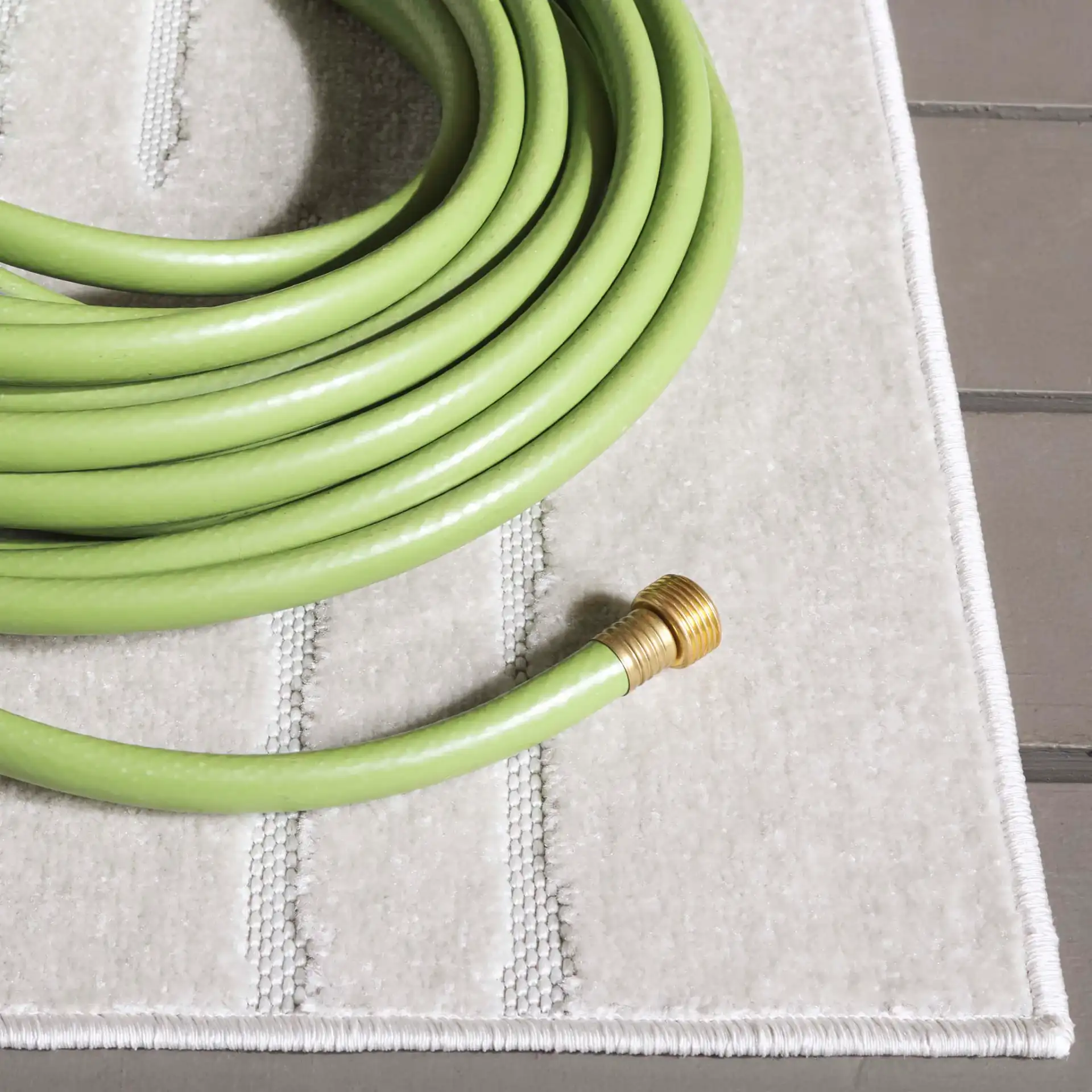 Stella Staggered Stripe Outdoor Rug in Ivory in a styled room