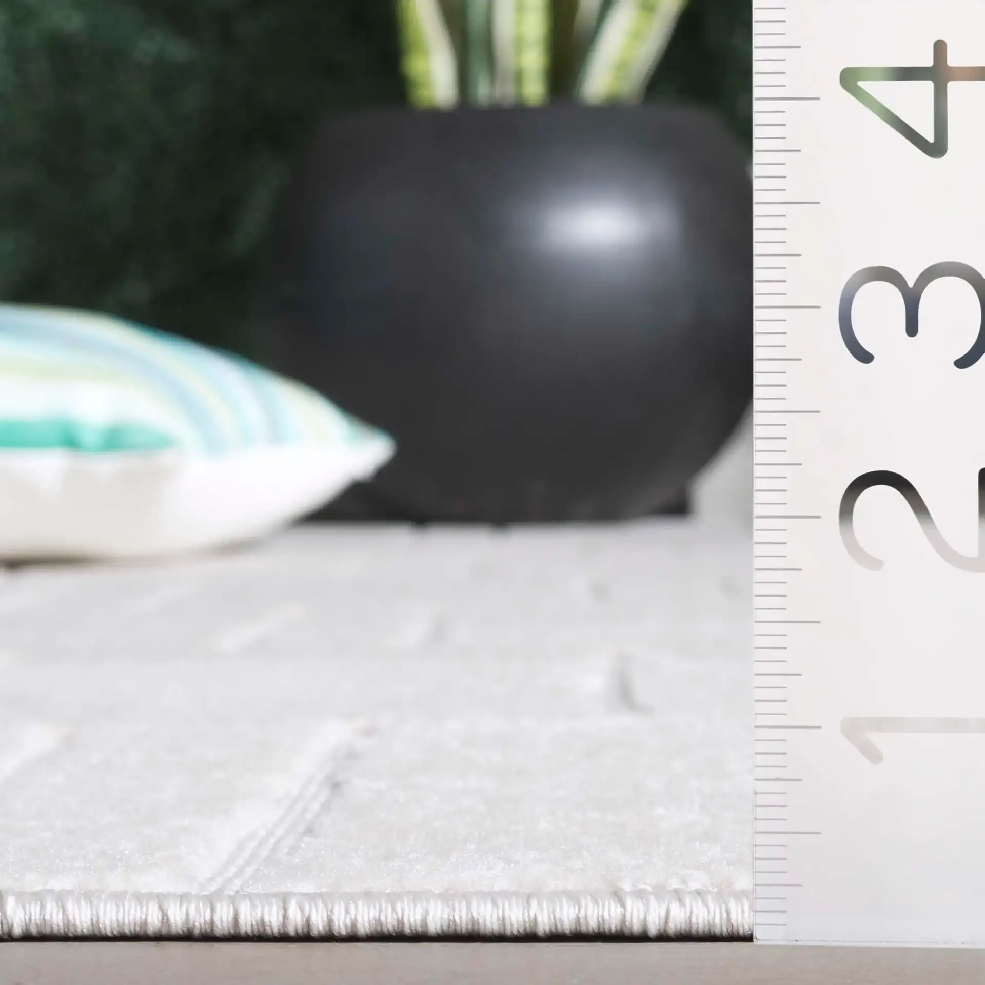 Stella Staggered Stripe Outdoor Rug in Ivory in a styled room