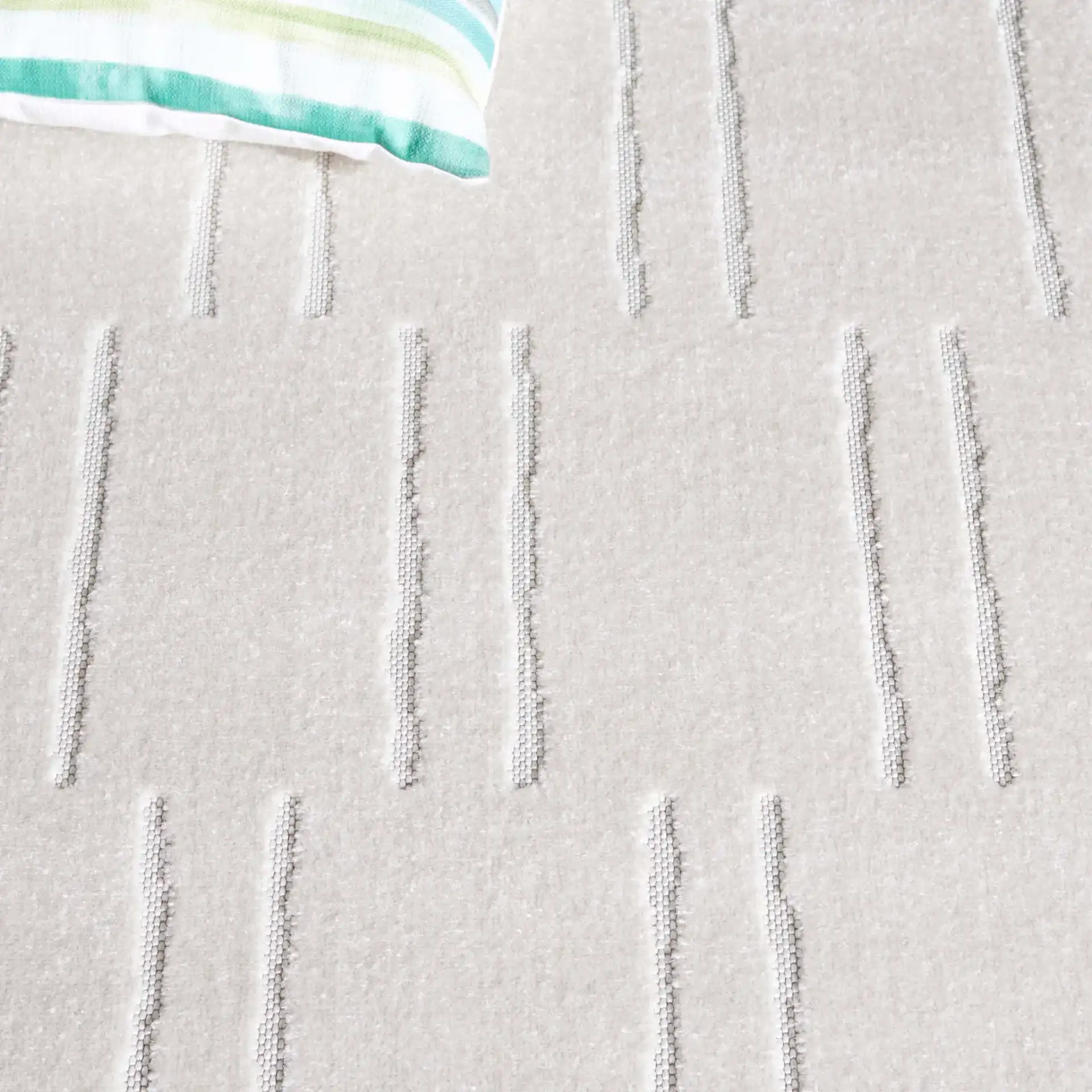 Stella Staggered Stripe Outdoor Rug in Ivory in a styled room