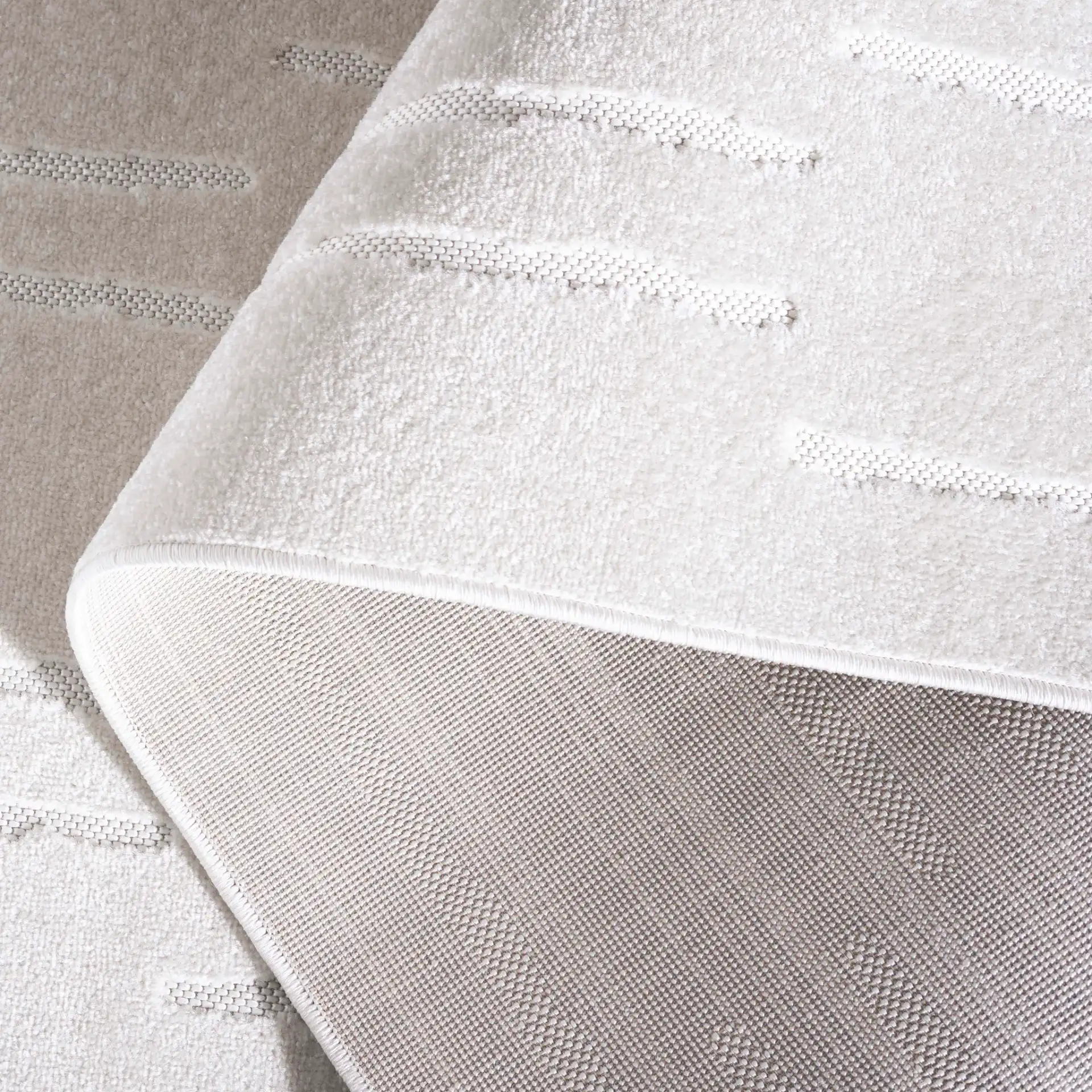Stella Staggered Stripe Outdoor Rug in Ivory in a styled room