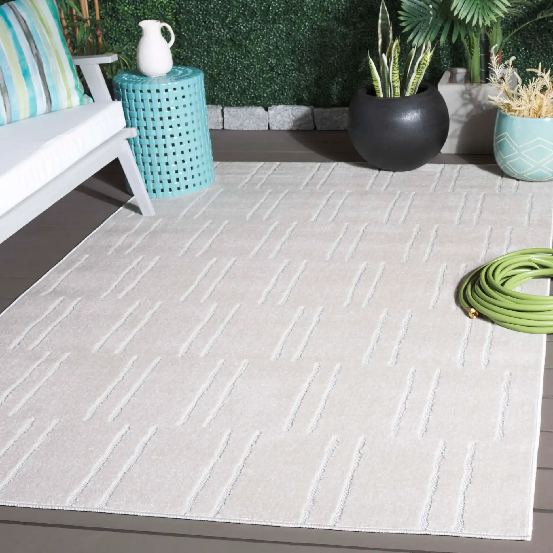 Stella Staggered Stripe Outdoor Rug in Ivory in a styled room