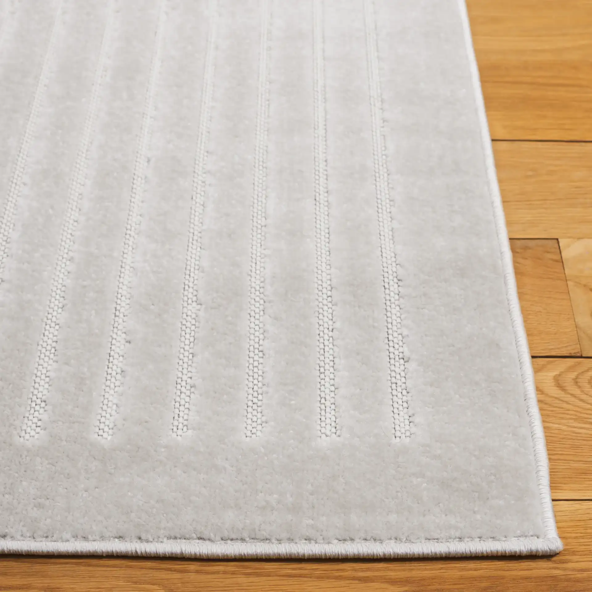 Stella Mirrored Arch Outdoor Rug in Ivory in a styled room