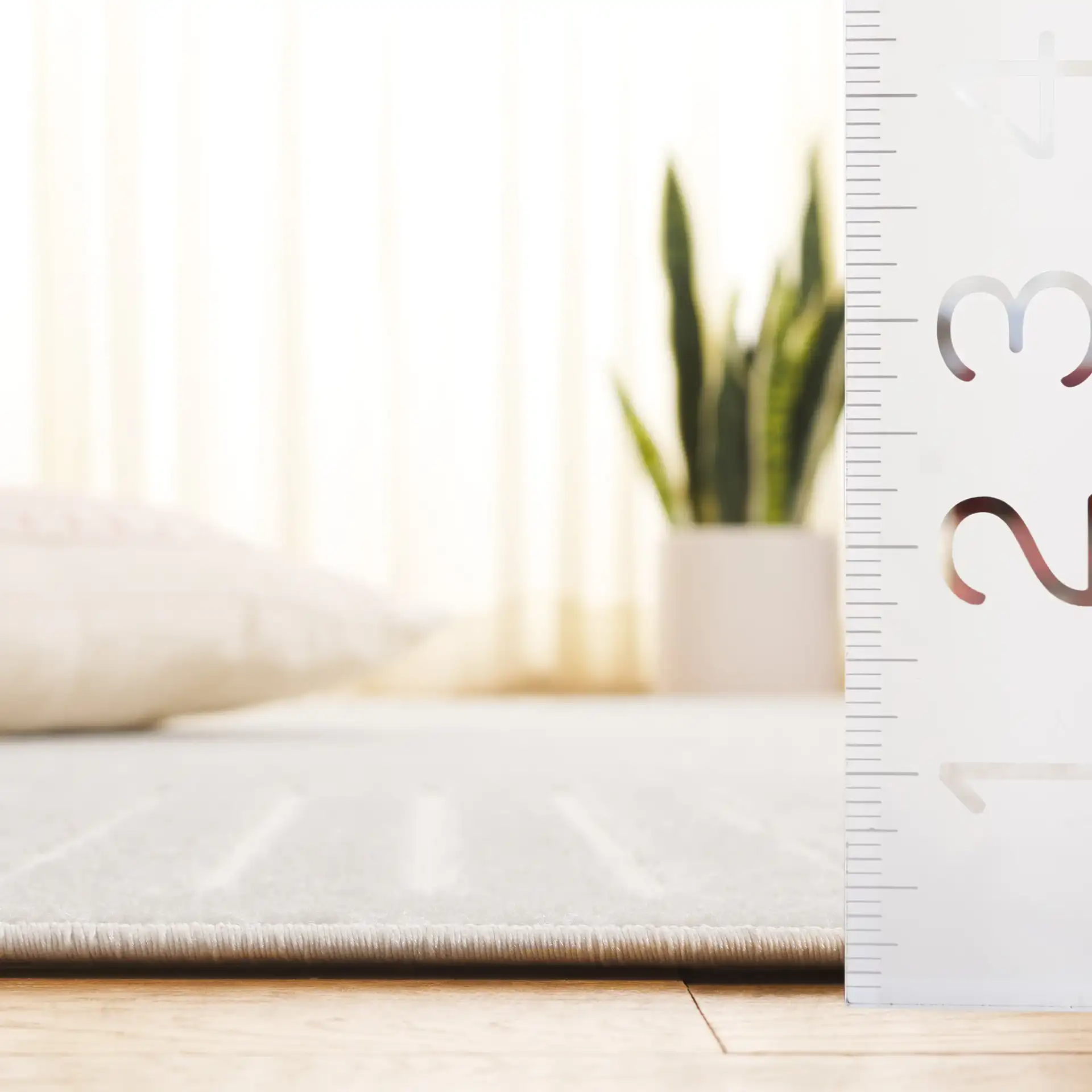 Stella Mirrored Arch Outdoor Rug in Ivory in a styled room