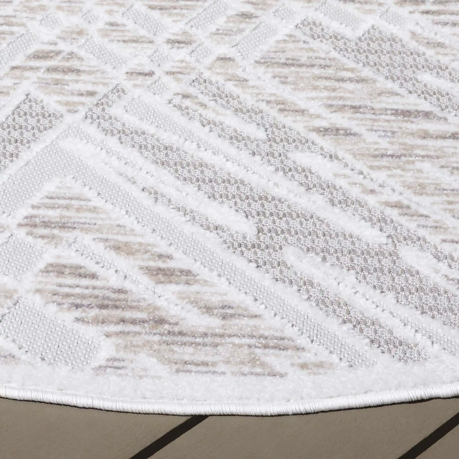 Stella Overlapping Grid Outdoor Rug in Ivory / Beige in a styled room