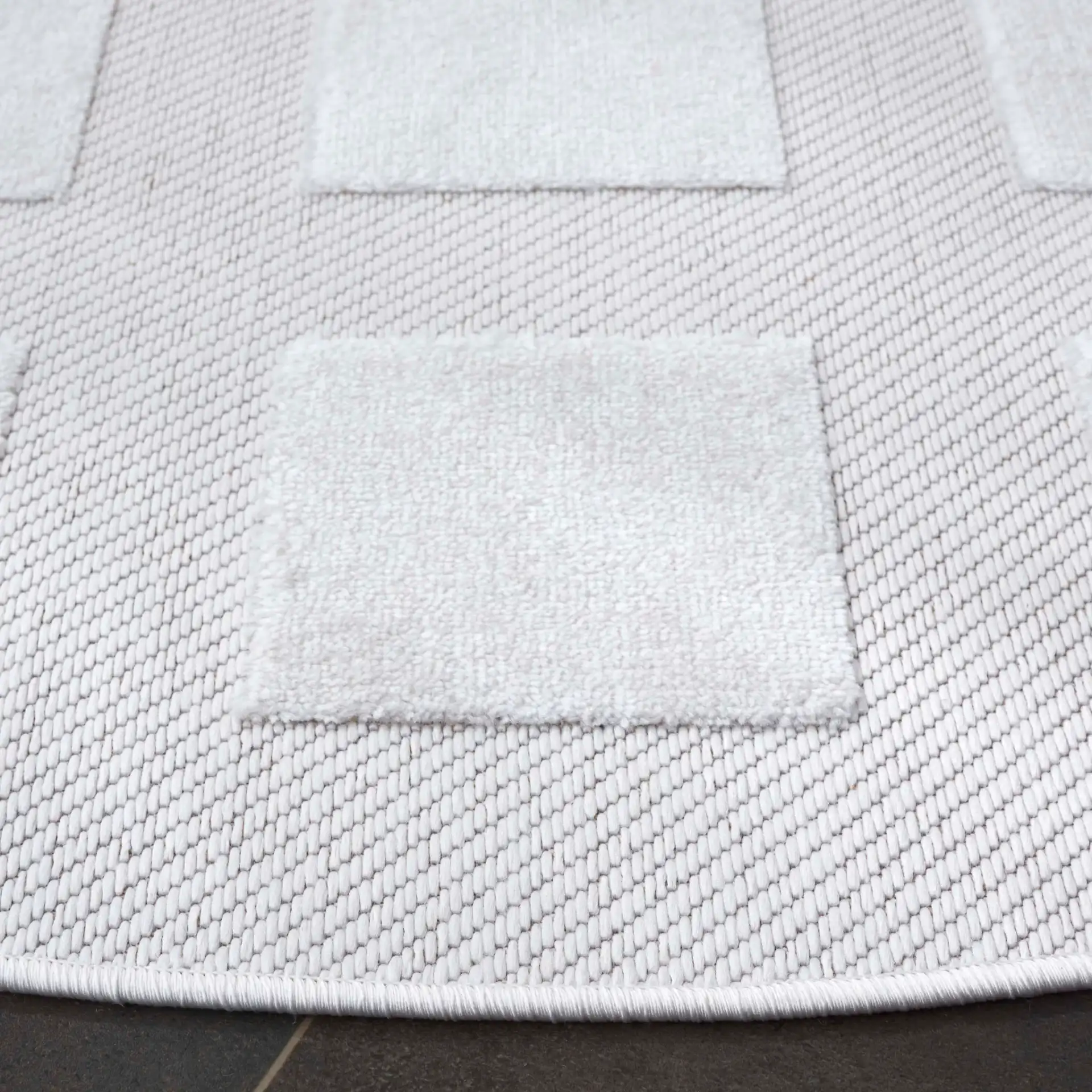 Stella Square Grid Outdoor Rug in Ivory in a styled room