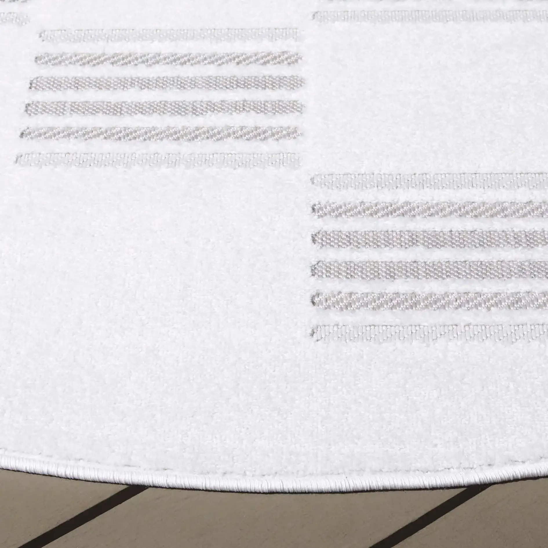 Stella Checkerboard Stripe Outdoor Rug in Ivory / Beige in a styled room