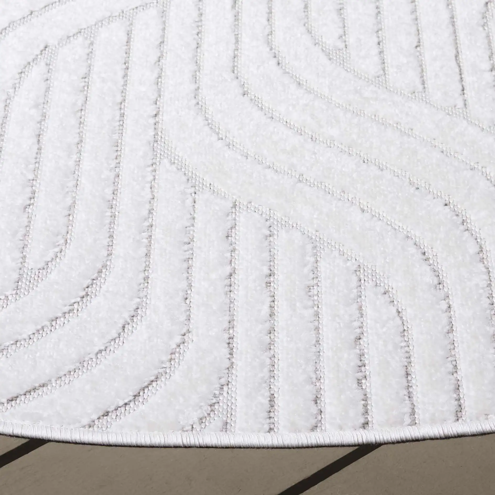 Stella Wave Outdoor Rug in Ivory in a styled room