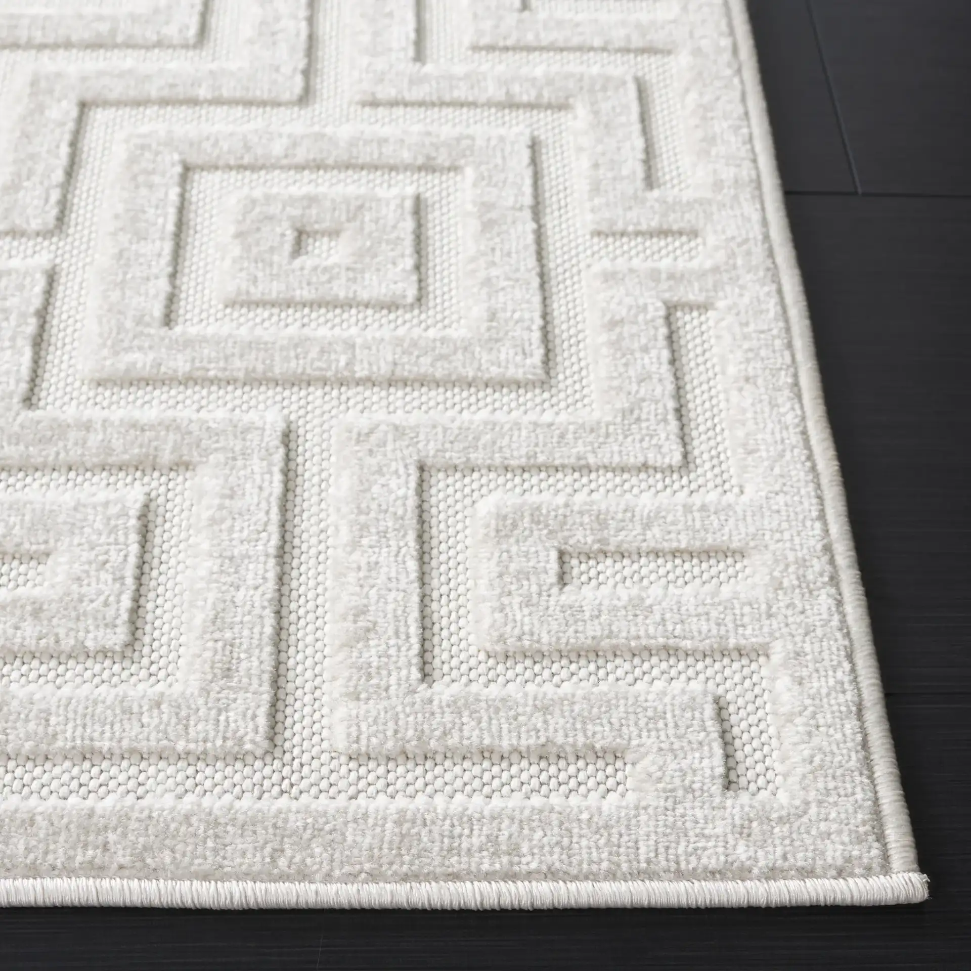 Stella Interlocking Squares Outdoor Rug in Ivory in a styled room