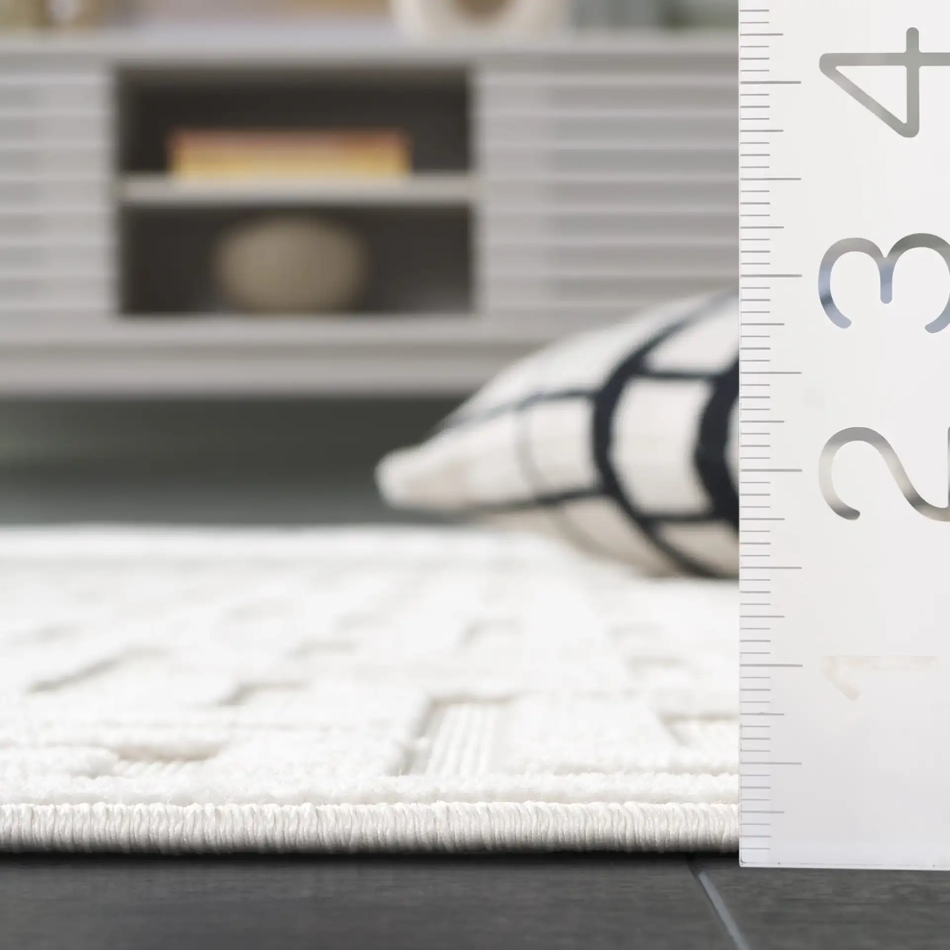 Stella Interlocking Squares Outdoor Rug in Ivory in a styled room