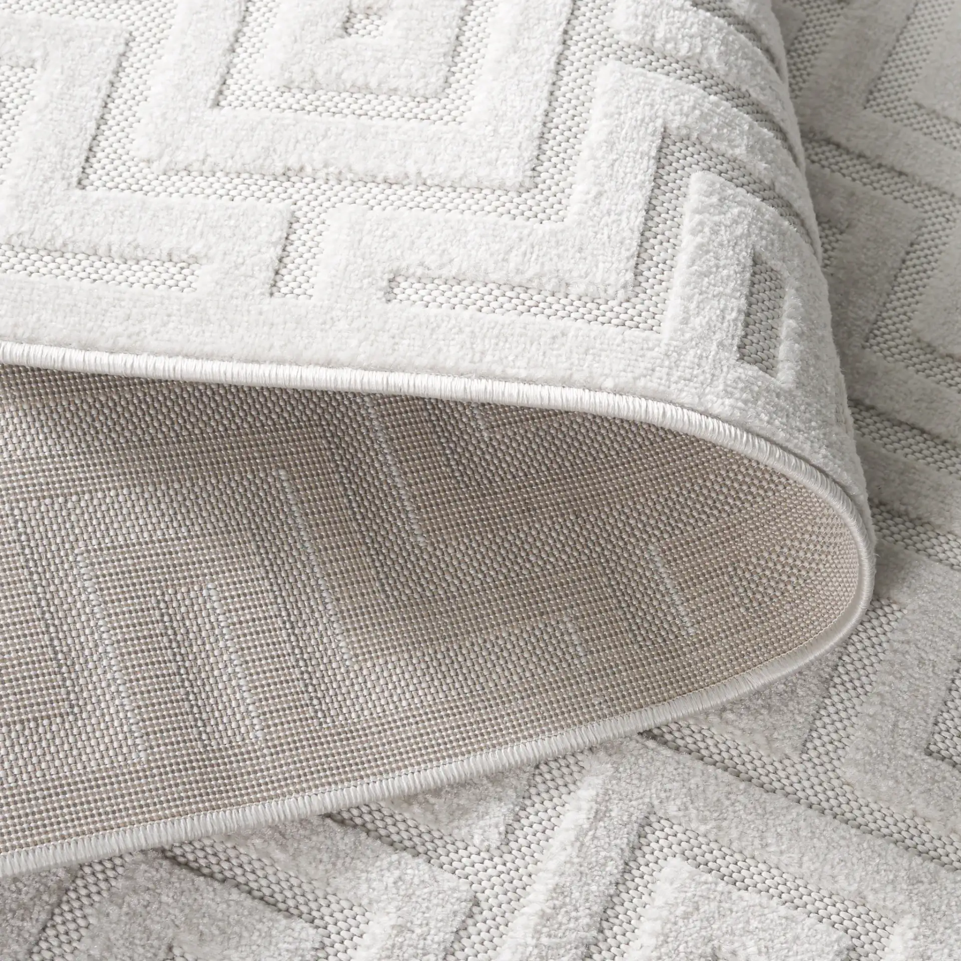 Stella Interlocking Squares Outdoor Rug in Ivory in a styled room