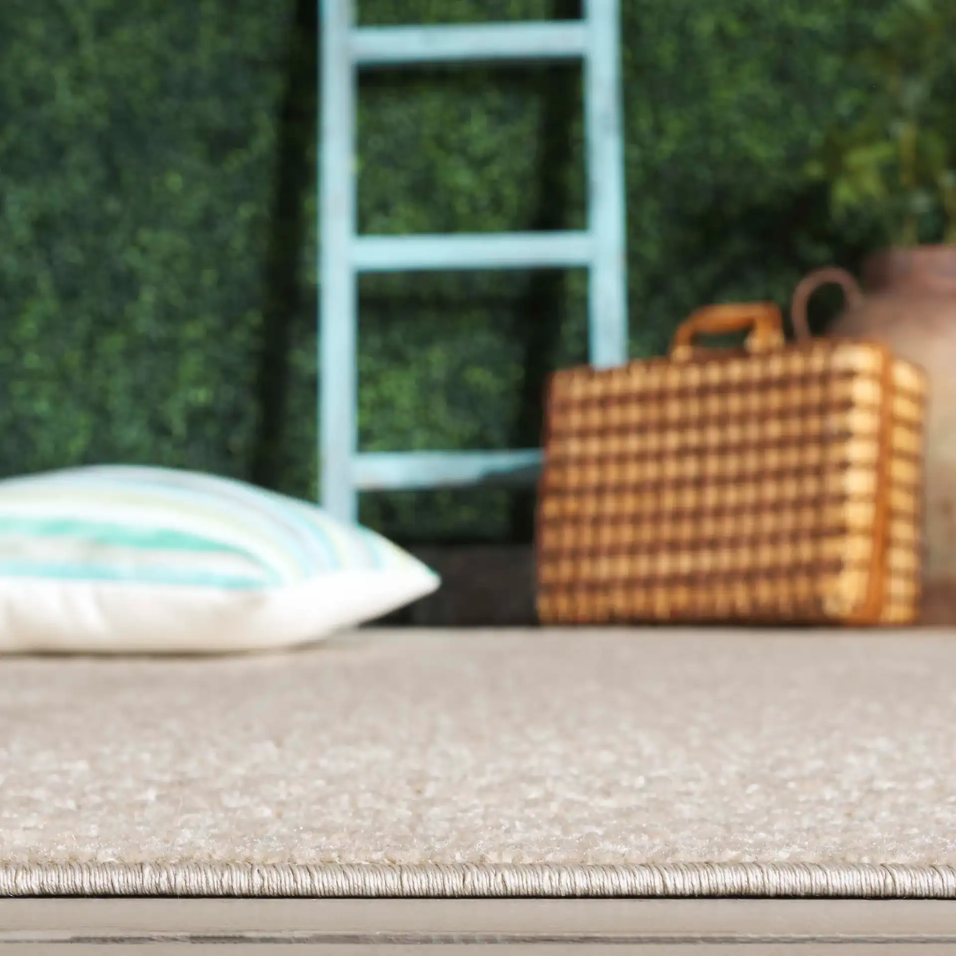 Stella Basketweave Outdoor Rug in Beige in a styled room