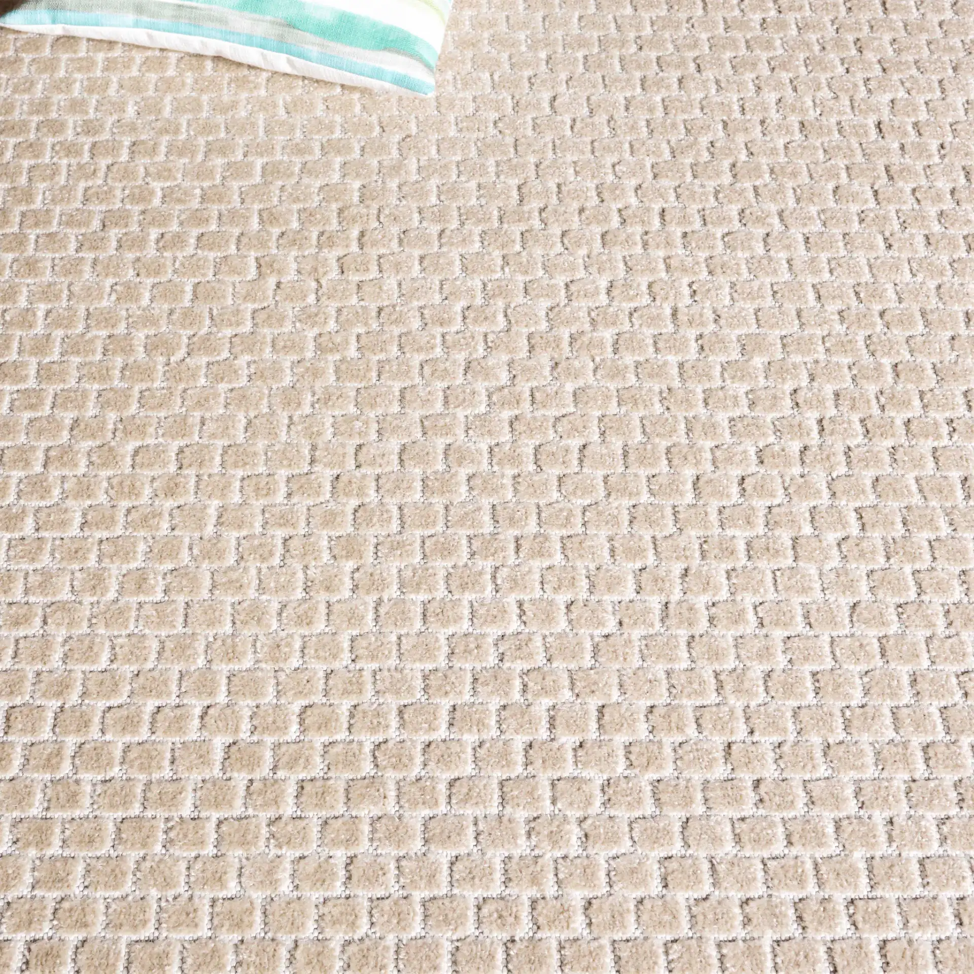 Stella Basketweave Outdoor Rug in Beige in a styled room