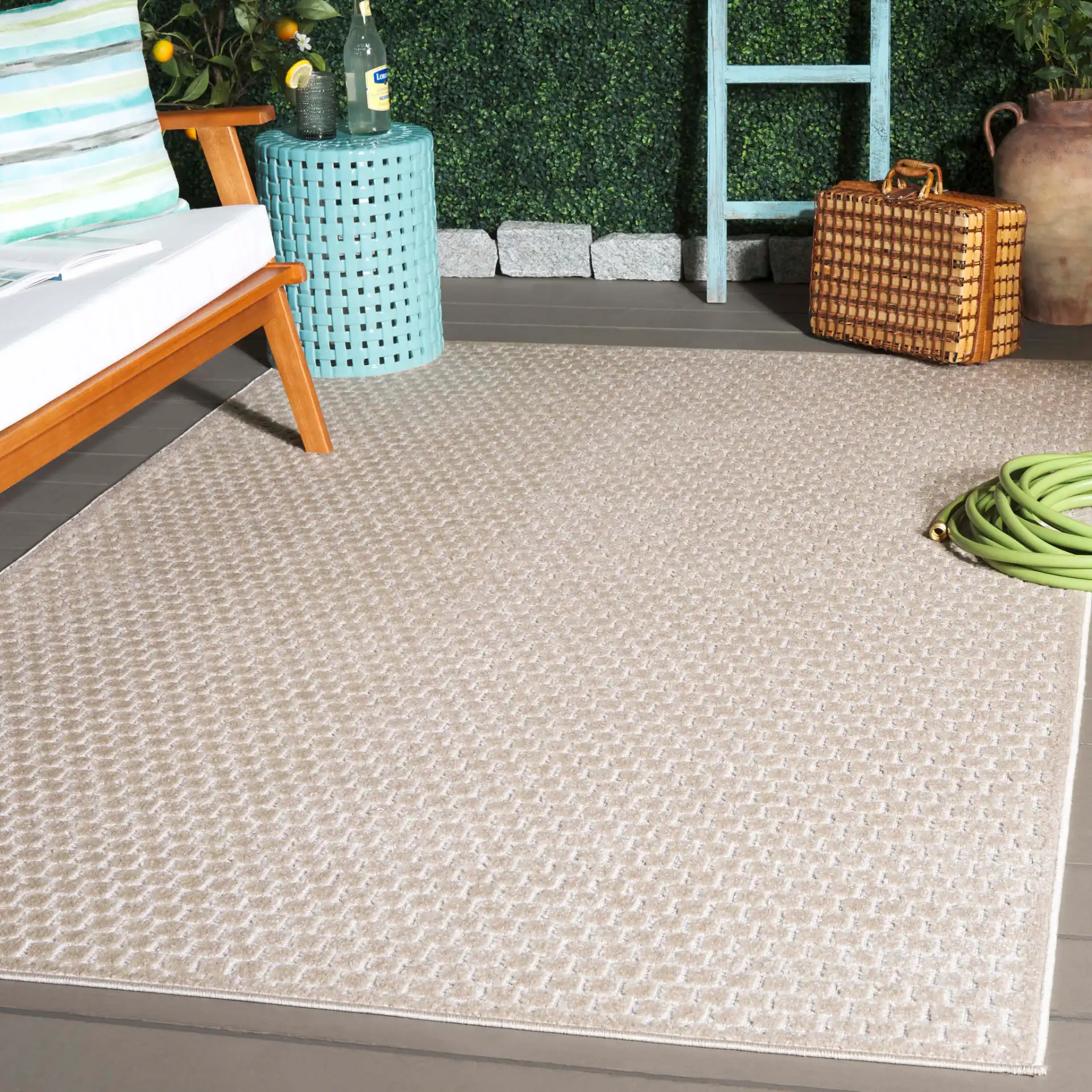 Stella Basketweave Outdoor Rug in Beige in a styled room