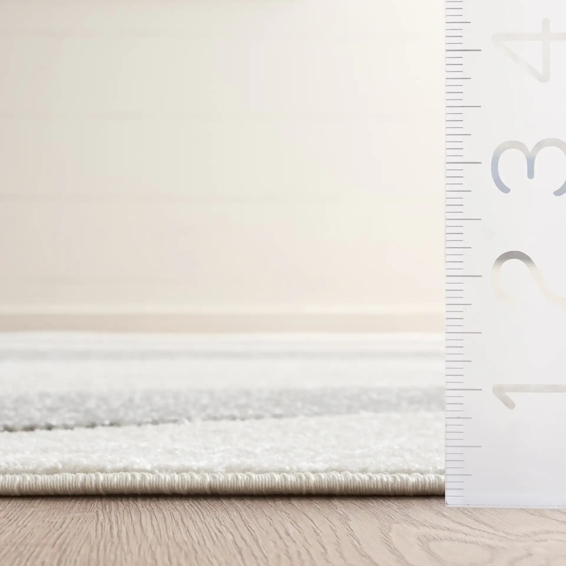 Stella Modern Wave Rug in Ivory / Gray in a styled room