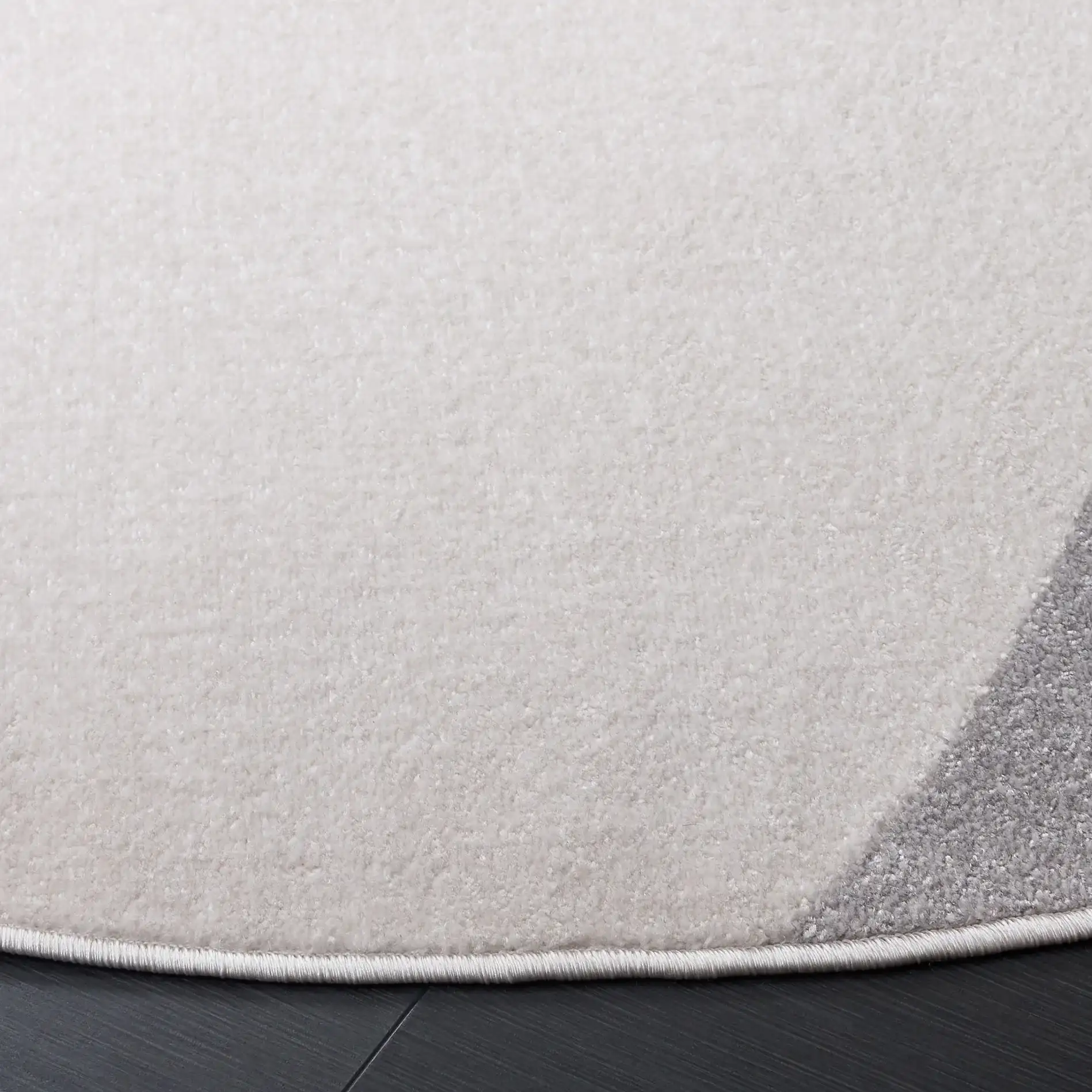 Stella Modern Wave Rug in Ivory / Gray in a styled room