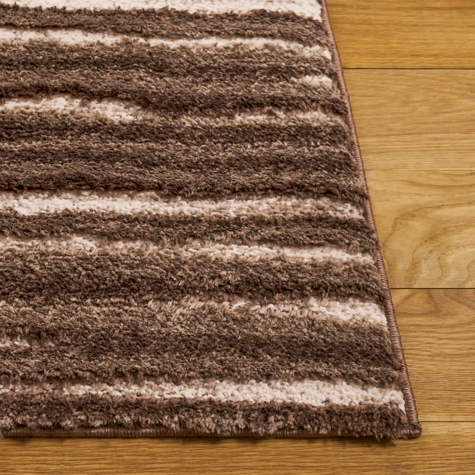 Seattle Ribbed Stripe Shag Rug in Brown / Ivory in a styled room