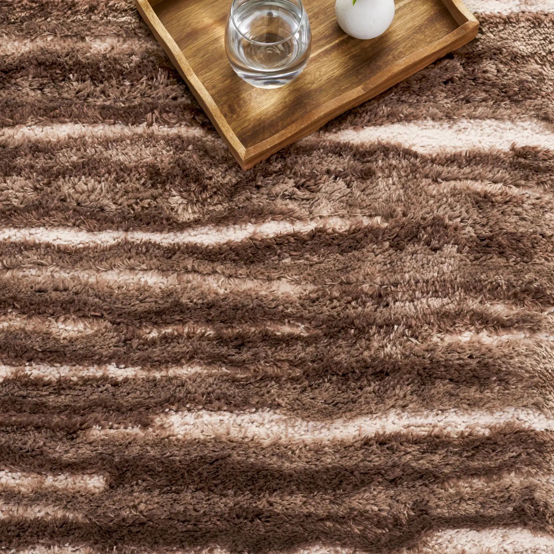 Seattle Ribbed Stripe Shag Rug in Brown / Ivory in a styled room