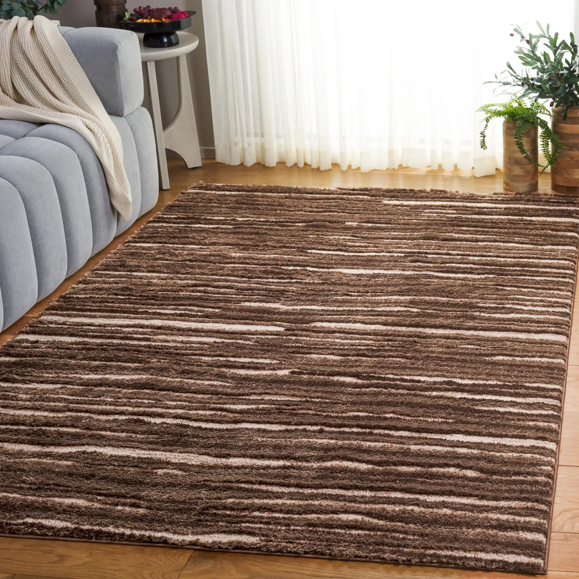 Seattle Ribbed Stripe Shag Rug in Brown / Ivory in a styled room