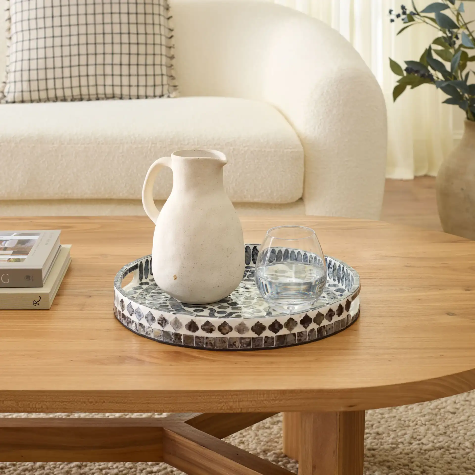 Yaneth Round Tray in Grey / White in a styled room