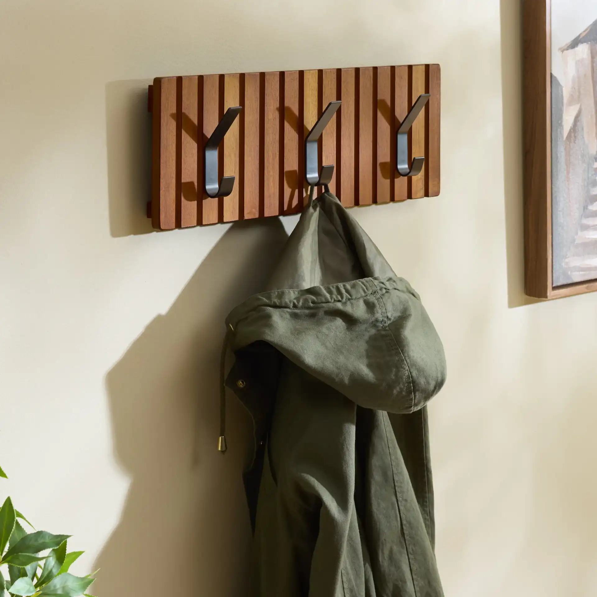 Fraizer Three-Hook Wall-Mounted Coat Rack in Natural Acacia / Black in a styled room