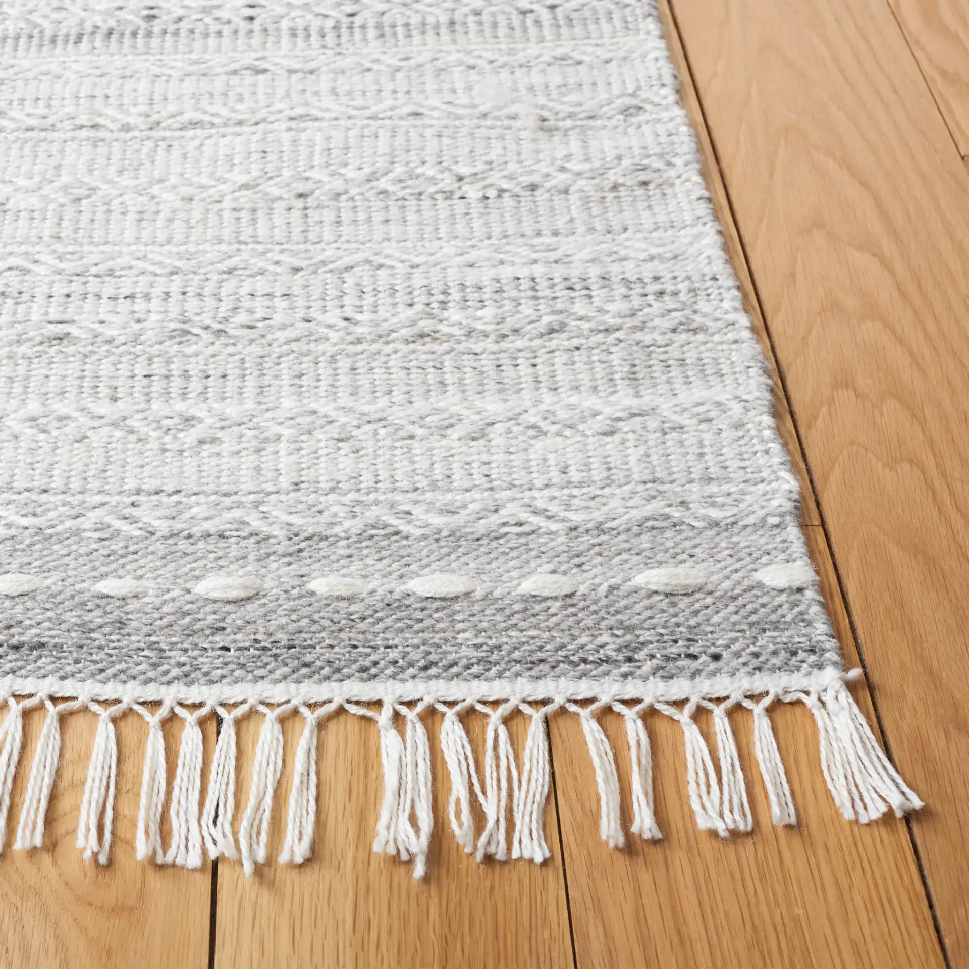 Striped Kilim Tonal Geometric Rug in Gray / Ivory in a styled room