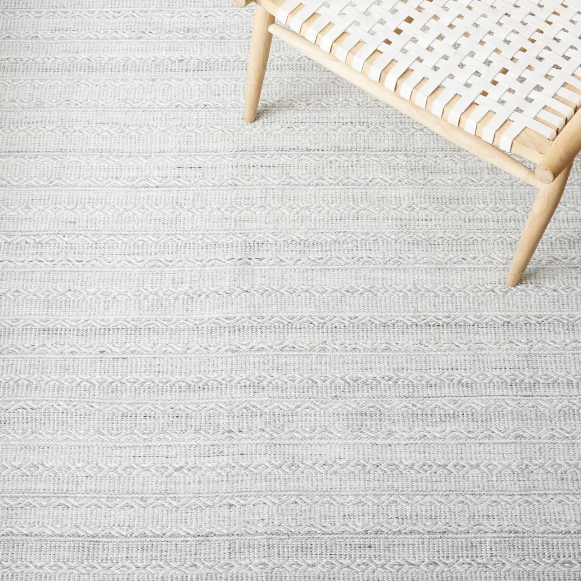 Striped Kilim Tonal Geometric Rug in Gray / Ivory in a styled room