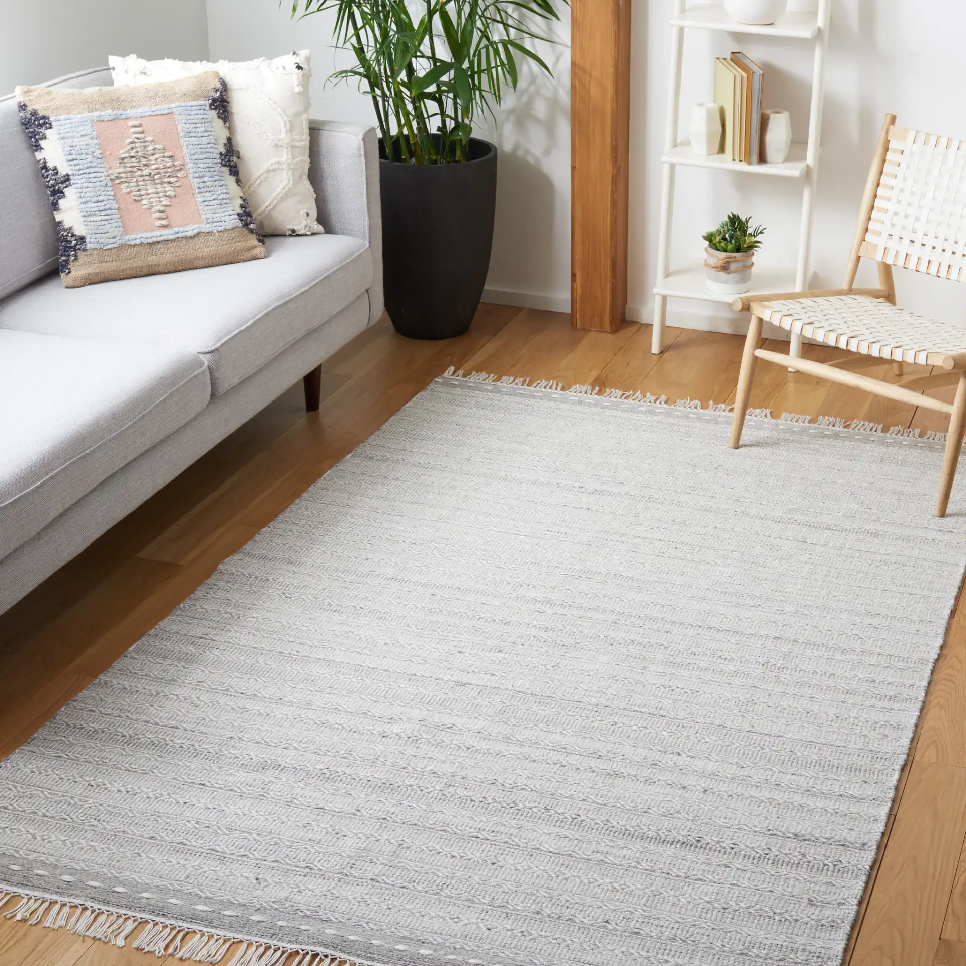 Striped Kilim Tonal Geometric Rug in Gray / Ivory in a styled room