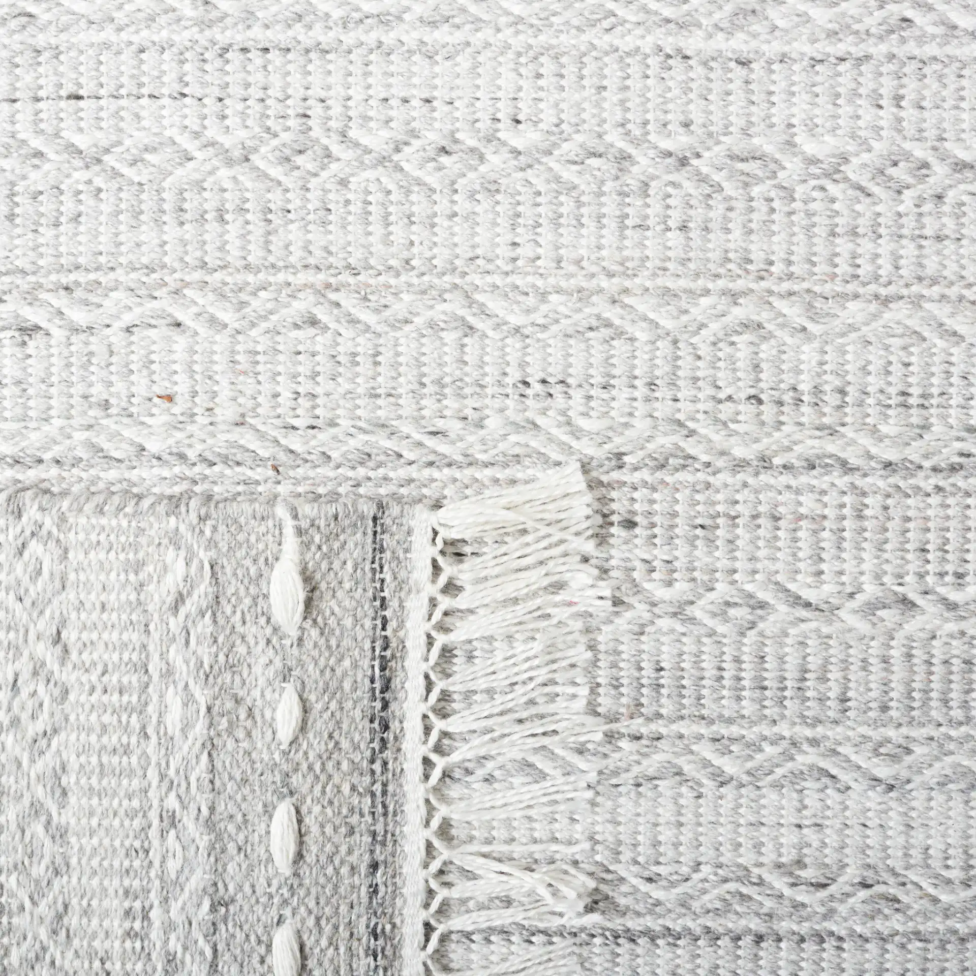 Striped Kilim Tonal Geometric Rug in Gray / Ivory in a styled room