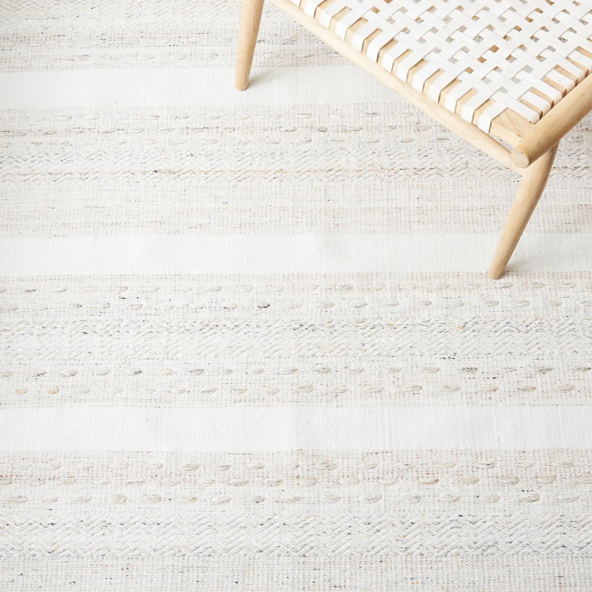 Striped Kilim Scandinavian Textured Rug in Beige / Ivory in a styled room