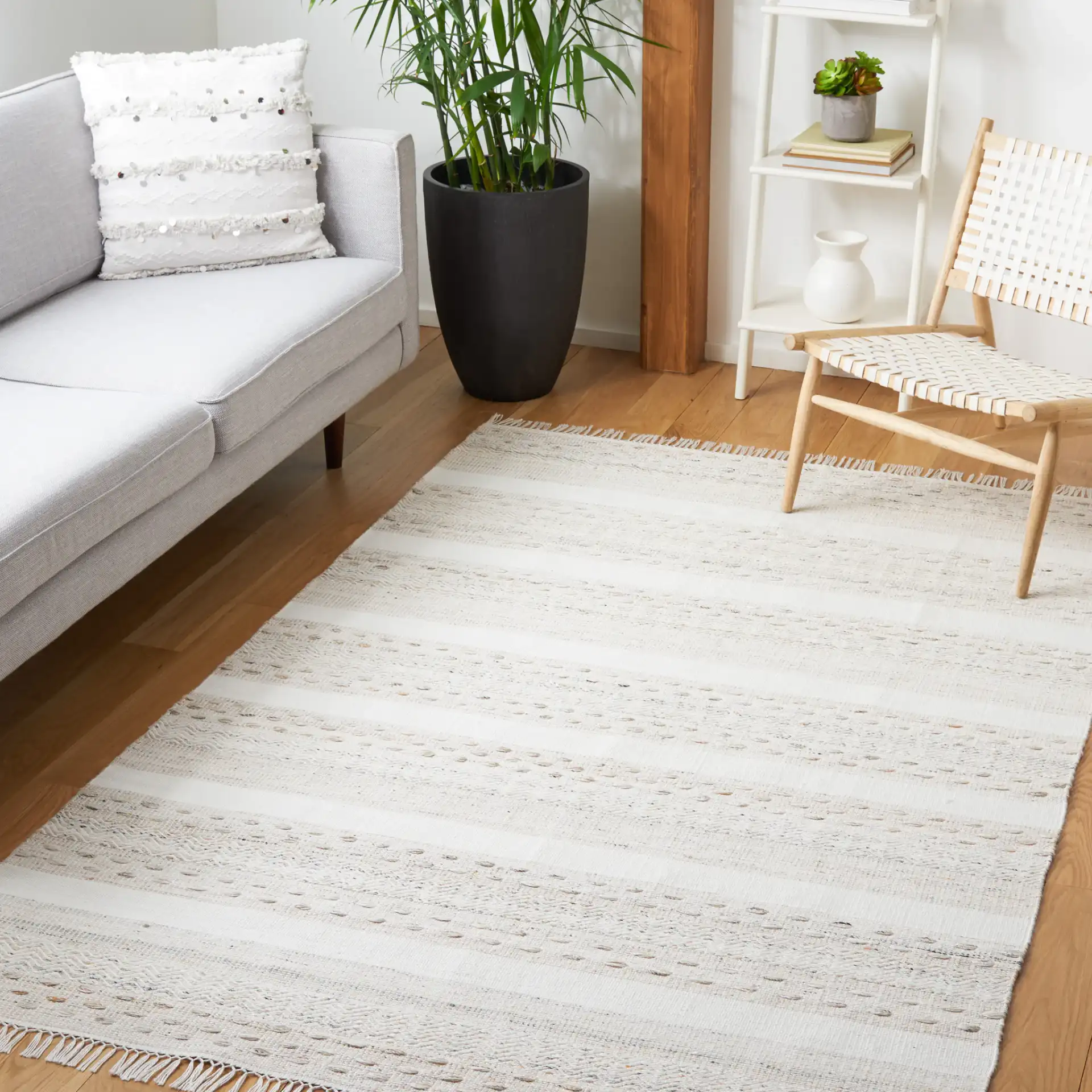 Striped Kilim Scandinavian Textured Rug in Beige / Ivory in a styled room