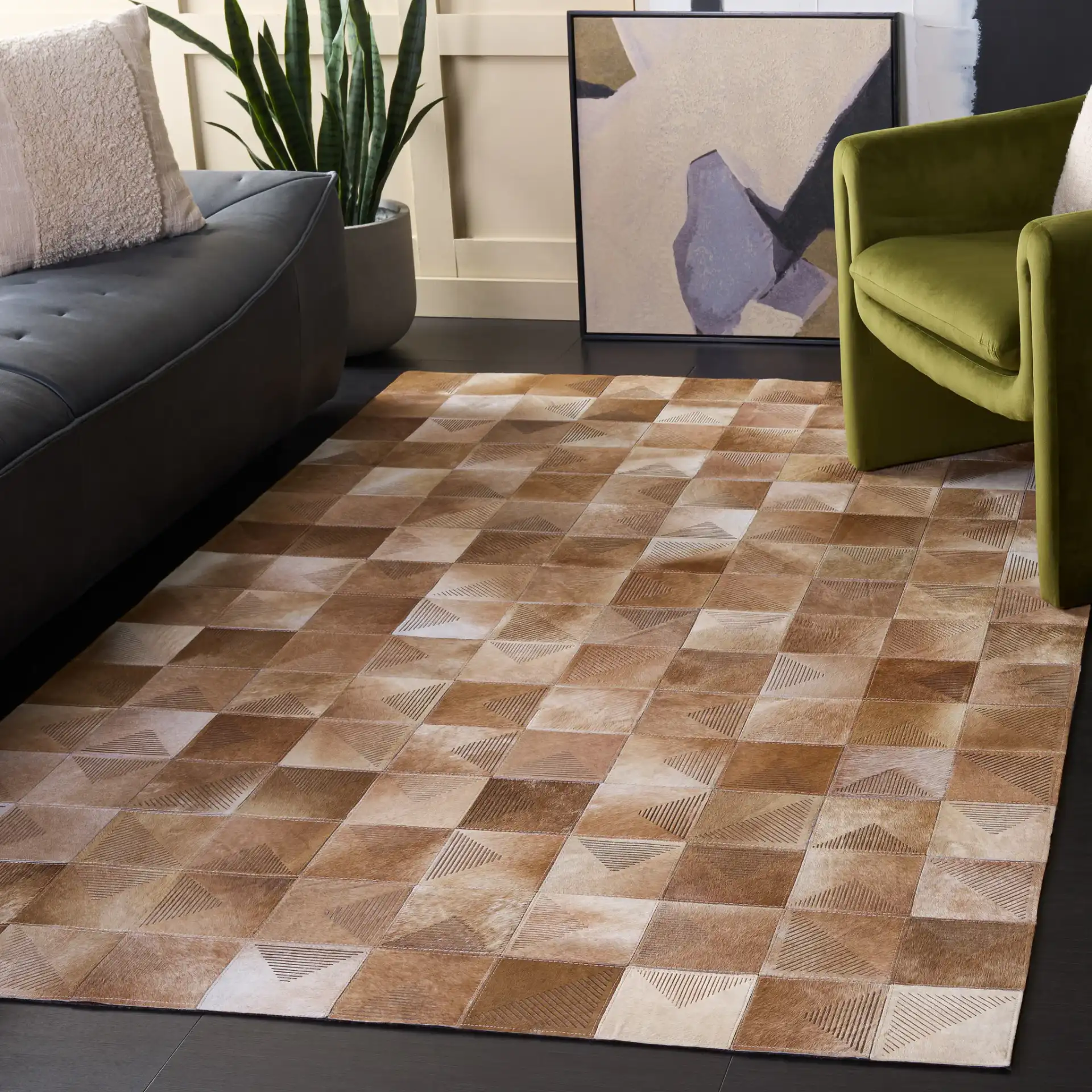 Studio Leather Geometric Patchwork Hand-Woven Rug in Beige / Brown in a styled room