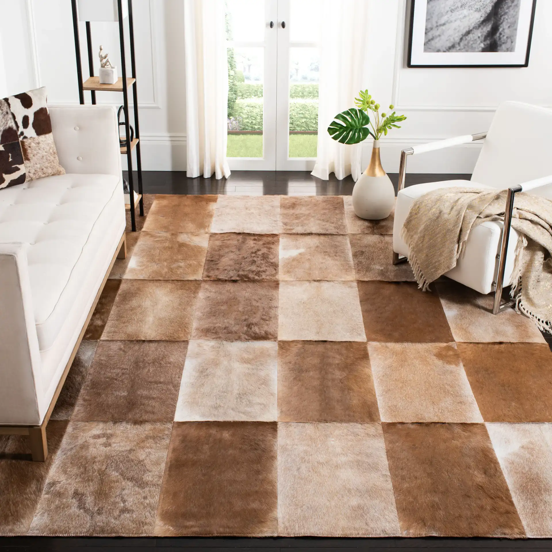 Studio Leather Patchwork Geometric Hand-Woven Rug in Beige / Brown in a styled room