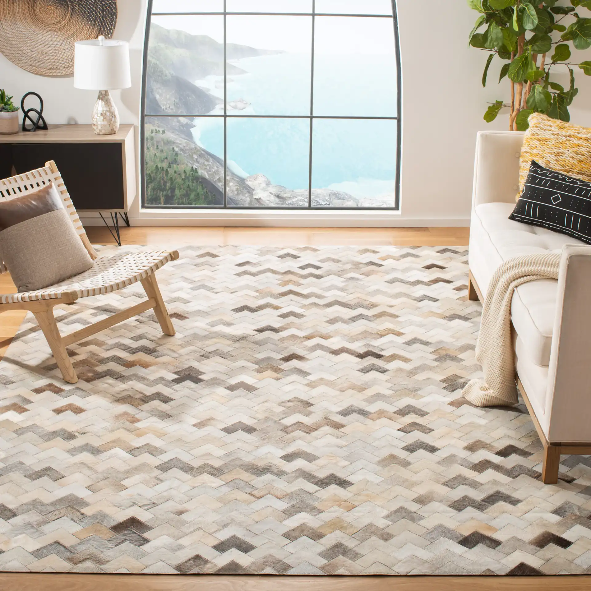 Studio Leather Chevron Patchwork Hand-Woven Rug in Gray in a styled room