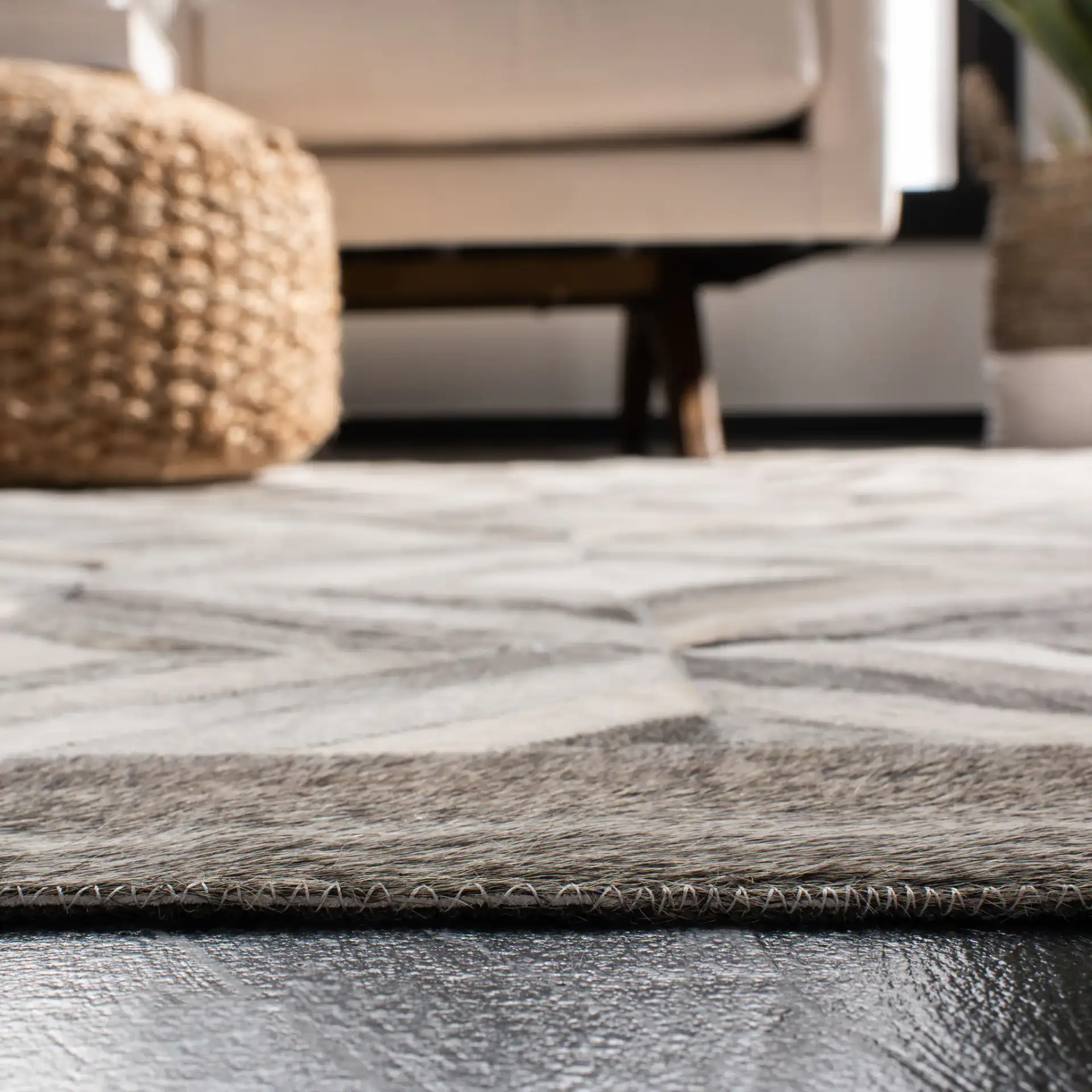 Studio Leather Patchwork Diamond Hand-Woven Rug in Gray in a styled room